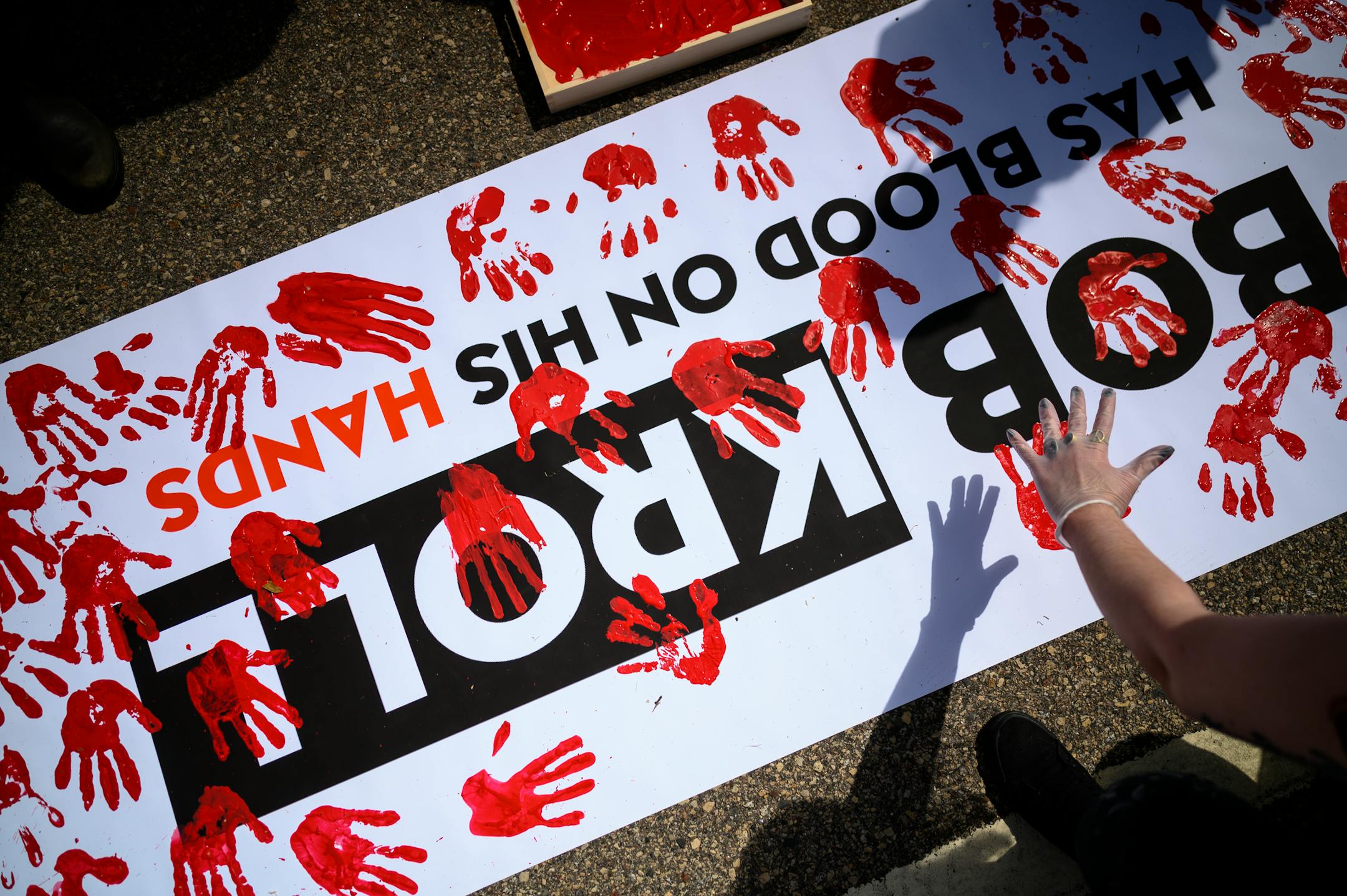 Protesters painted anti-Bob Kroll sign with red handprints, representing blood. ]
aaron.lavinsky@startribune.com Protesters took part in a "Bob KKKroll Must Go!" rally against the Minneapolis Police Union and its president outside the union headquarters on Friday, June 12, 2020 in MInneapolis, Minn.