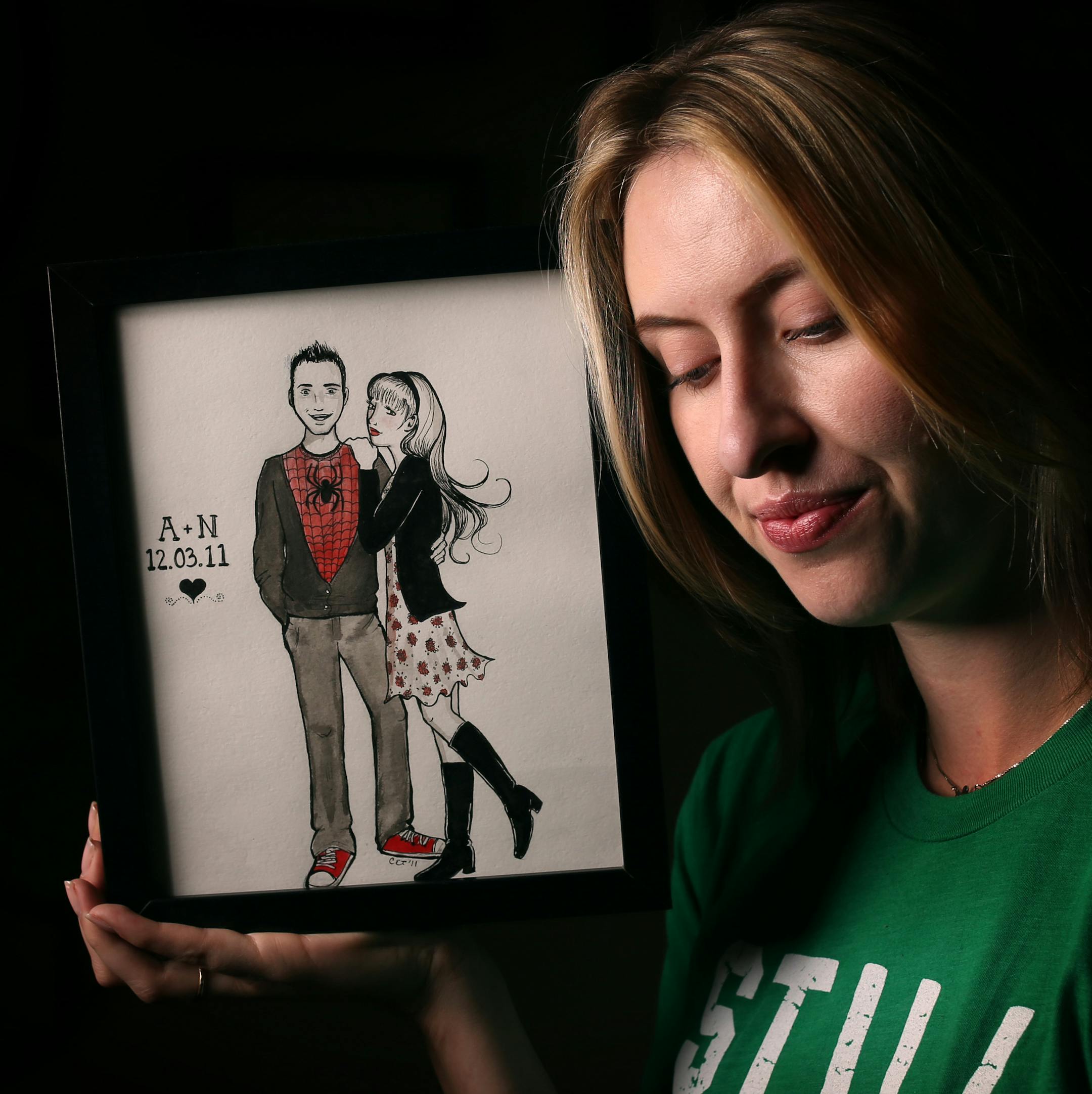 Nora McInerny Purmort with a drawing of herself and her husband, Aaron, who died of cancer in November 2014.