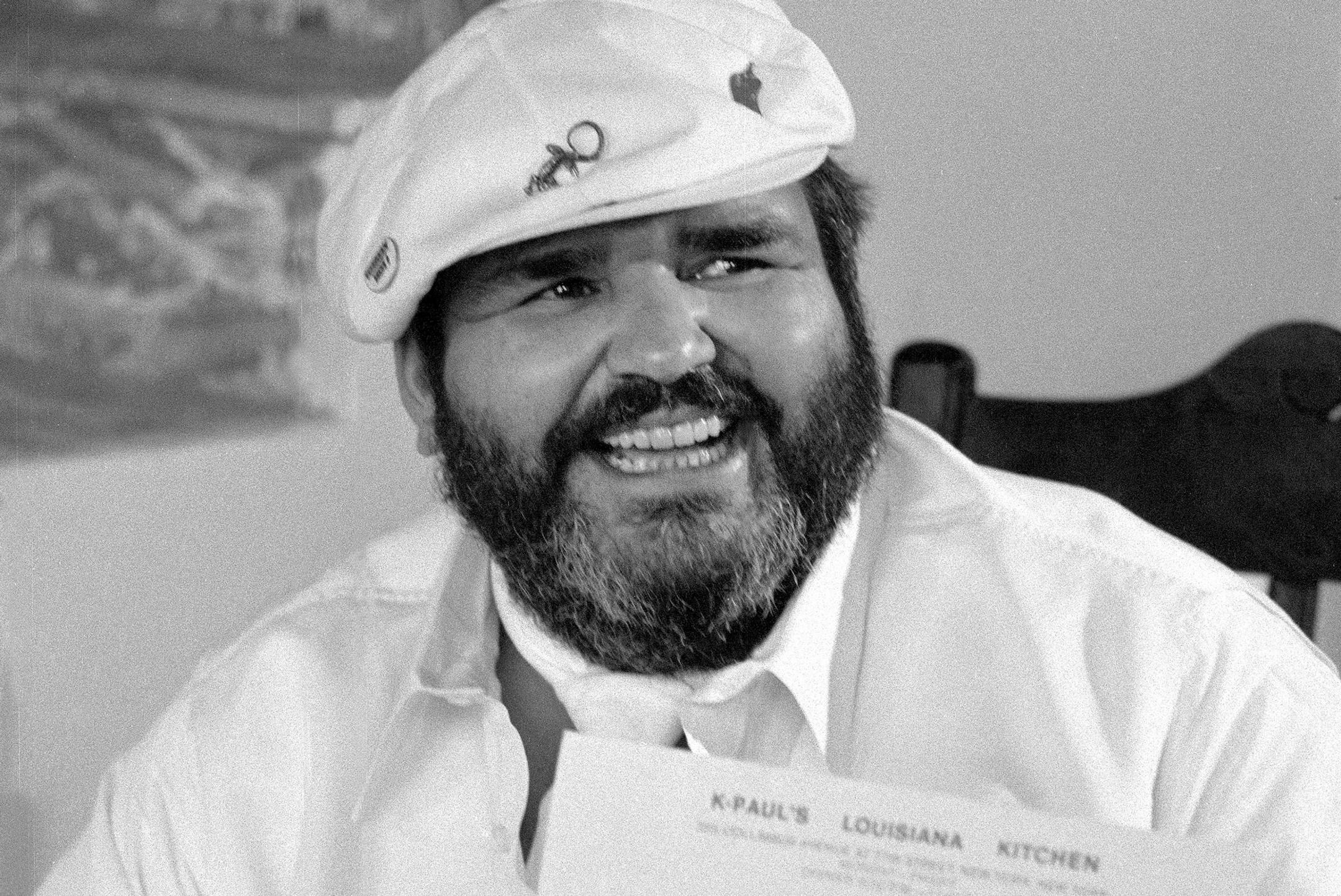 FILE-- Chef Paul Prudhomme, owner of K-Paul's Louisiana Kitchen, trying to reopen his roadshow version of K-Paul's after city health inspectors told him to close the premises, in New York, July 24, 1985. Prudhomme, the affable, bearded celebrity chef who took Cajun cooking from the bayou to the mainstream with his New Orleans restaurant, television shows, cookbooks and culinary products, died on Oct. 8, 2015, in New Orleans. He was 75. (Marilynn K. Yee/The New York Times)