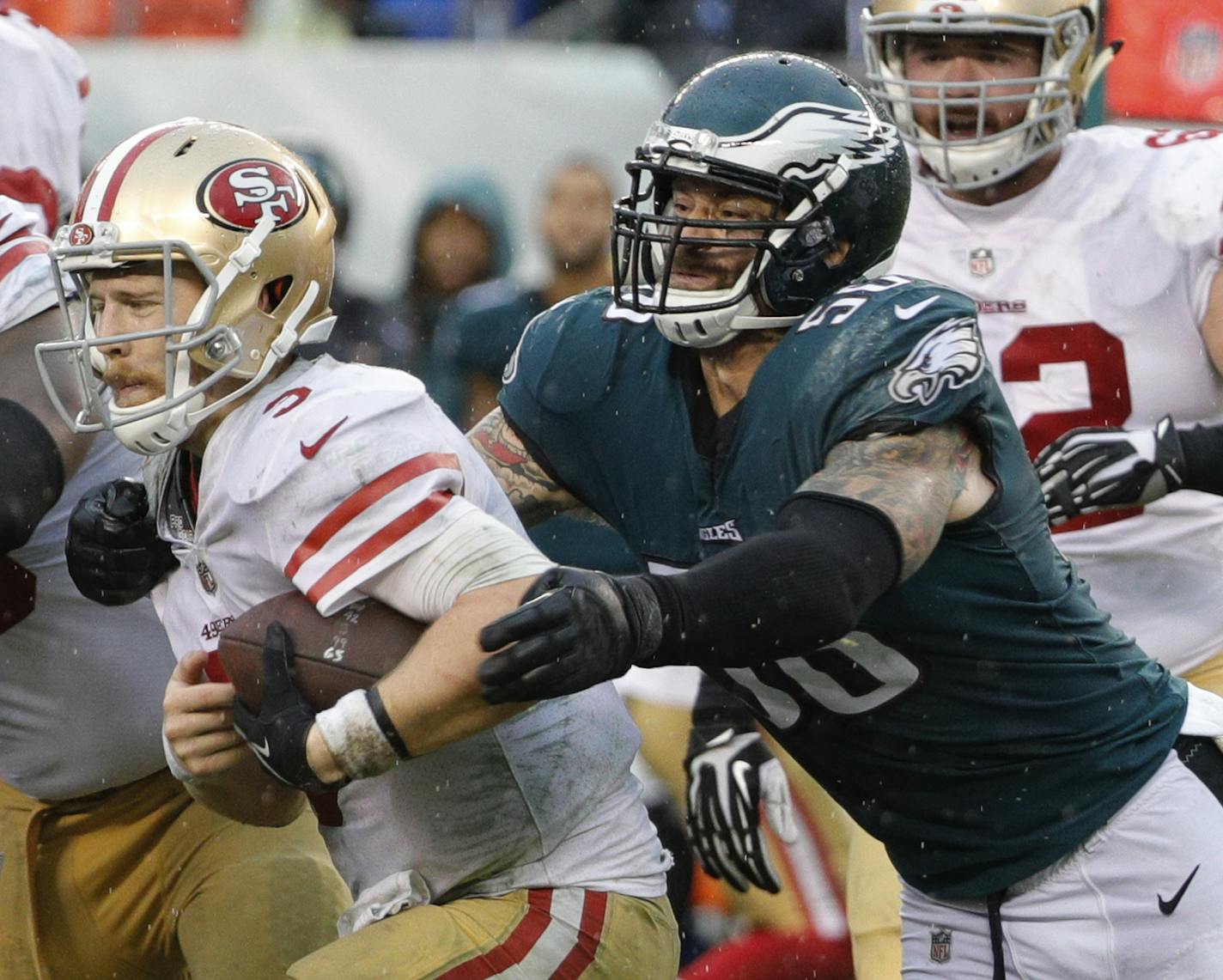 Philadelphia Eagles defensive end Chris Long reaches for San Francisco 49ers quarterback C.J. Beathard during an NFL football game, Sunday, Oct. 29, 2017, in Philadelphia. (AP Photo/Chris Szagola) ORG XMIT: OTKCS253