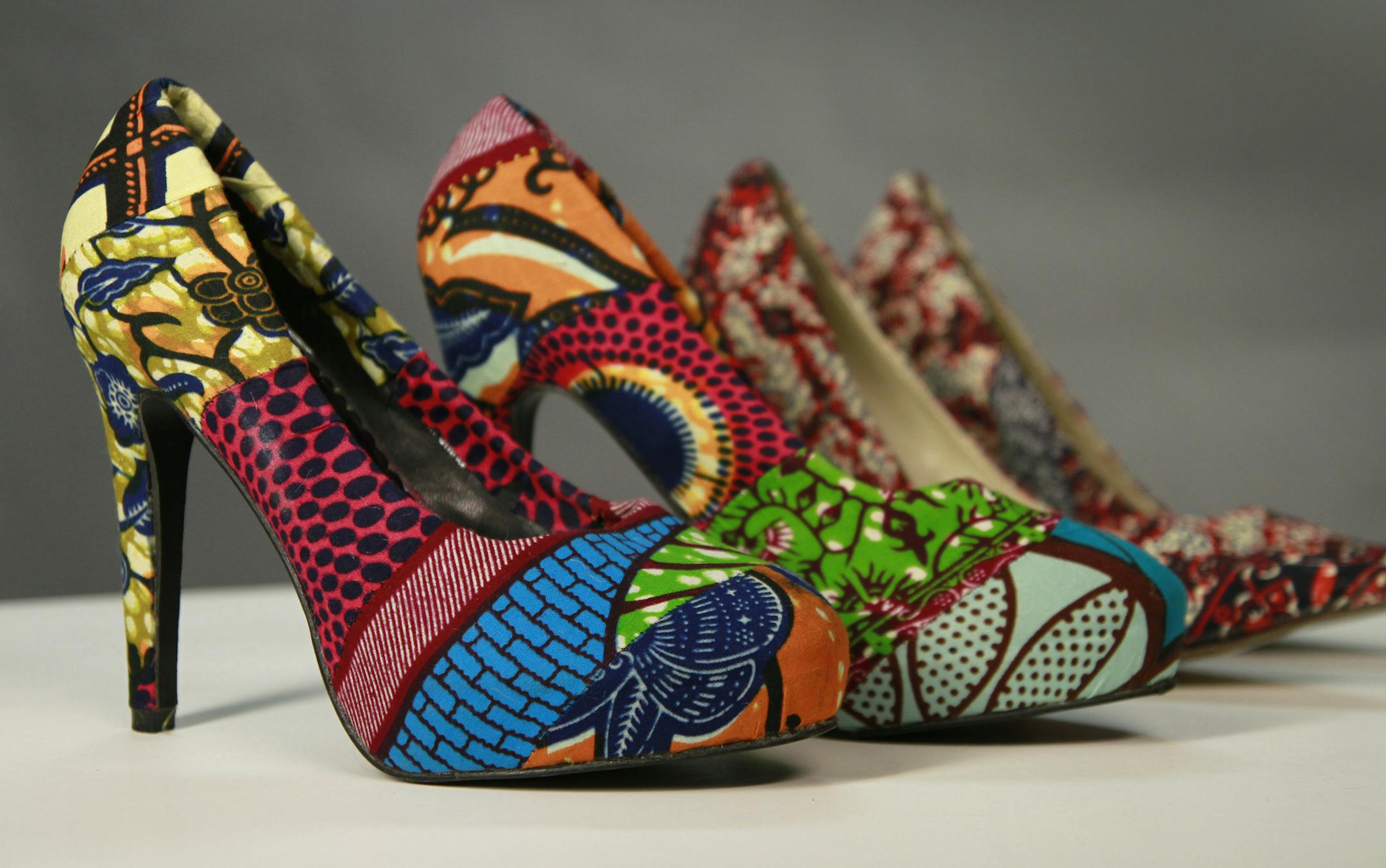 Nealst - biz profile of Joy McBrien, who started a business importing fashion wear items in an attempt to aid exploited women in other countries, example of some of the products she imports, including ' recycled' shoes ] Tom Sweeney, Star Tribune, March 25, 2015, Minneapolis, MN.