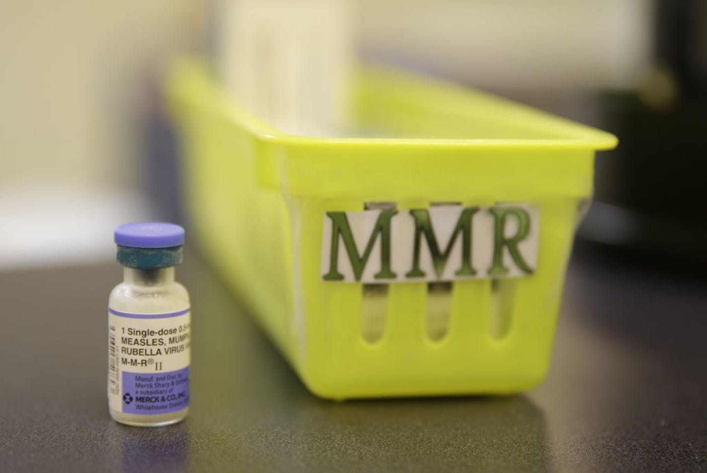 FILE - This Feb. 6, 2015, file photo shows a measles, mumps and rubella vaccine on a countertop at a pediatrics clinic in Greenbrae, Calif. The U.S. has counted more measles cases in the first two months of this year than in all of 2017 _ and part of the rising threat is misinformation that makes some parents balk at a crucial vaccine, federal health officials told Congress Wednesday, Feb. 27, 2019 .