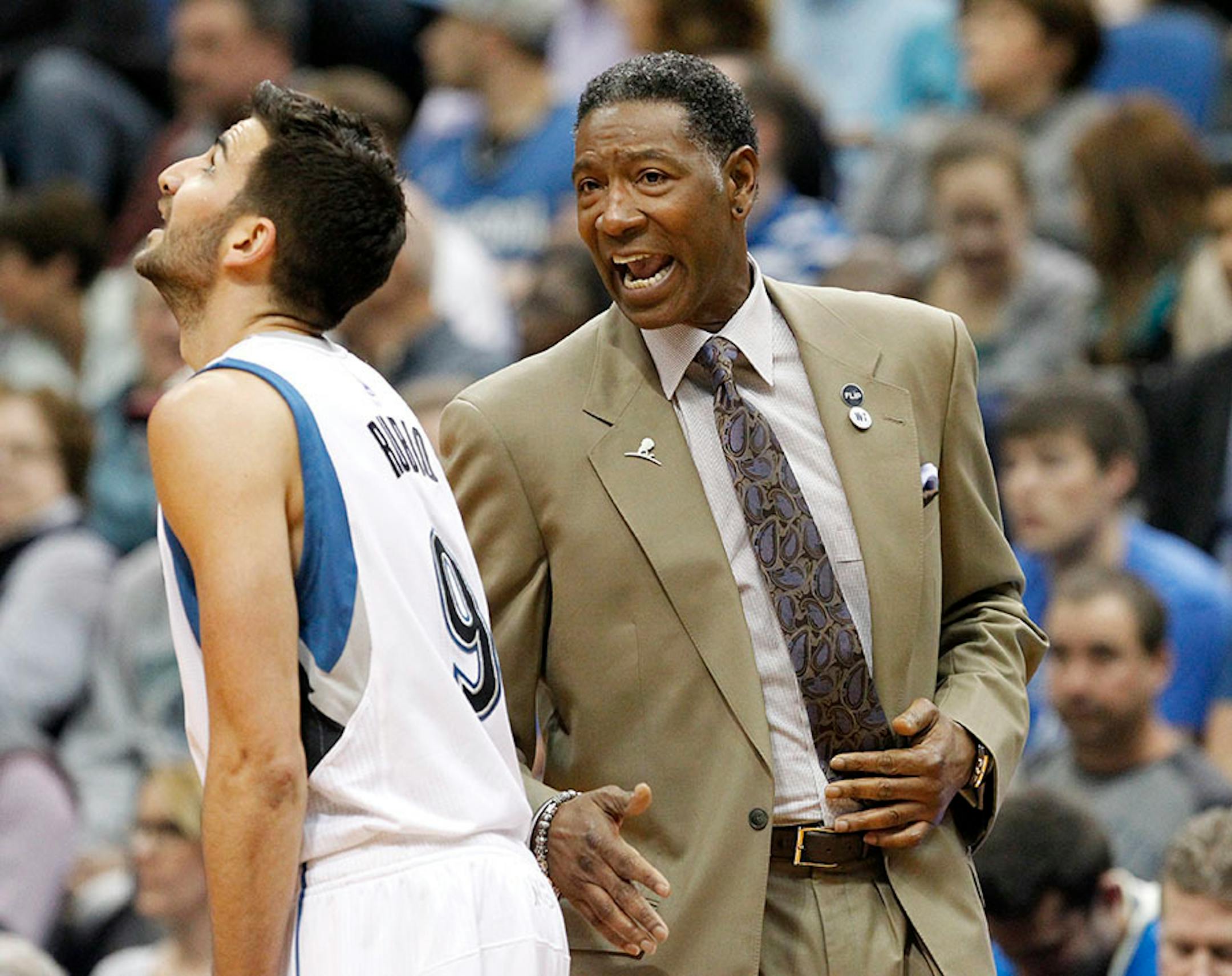 Minnesota Timberwolves head coach Sam Mitchell, right, talks with guard Ricky Rubio last month.