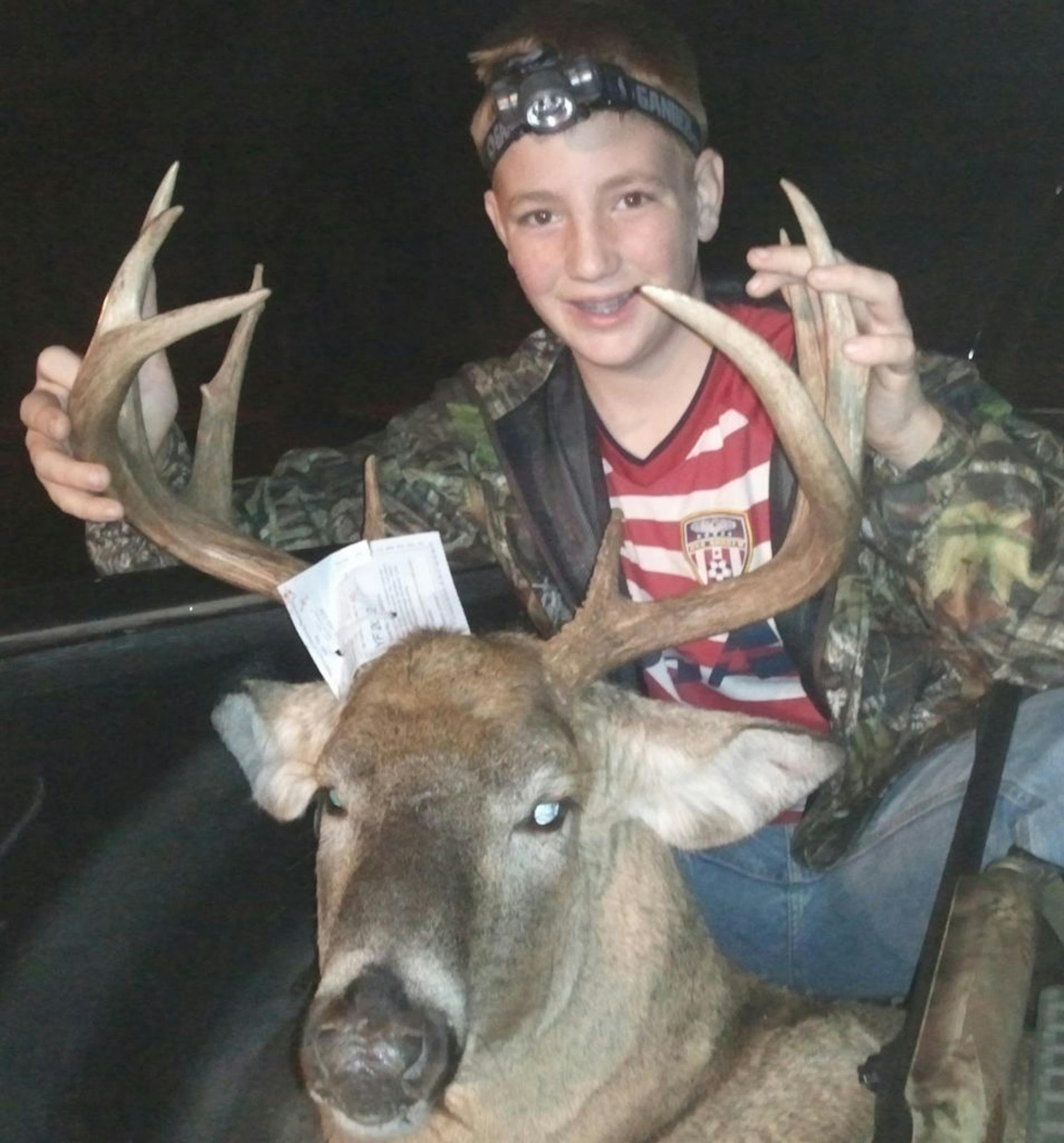 Evan Halet, 12, of Minneapolis, with an 11-point buck he bagged.