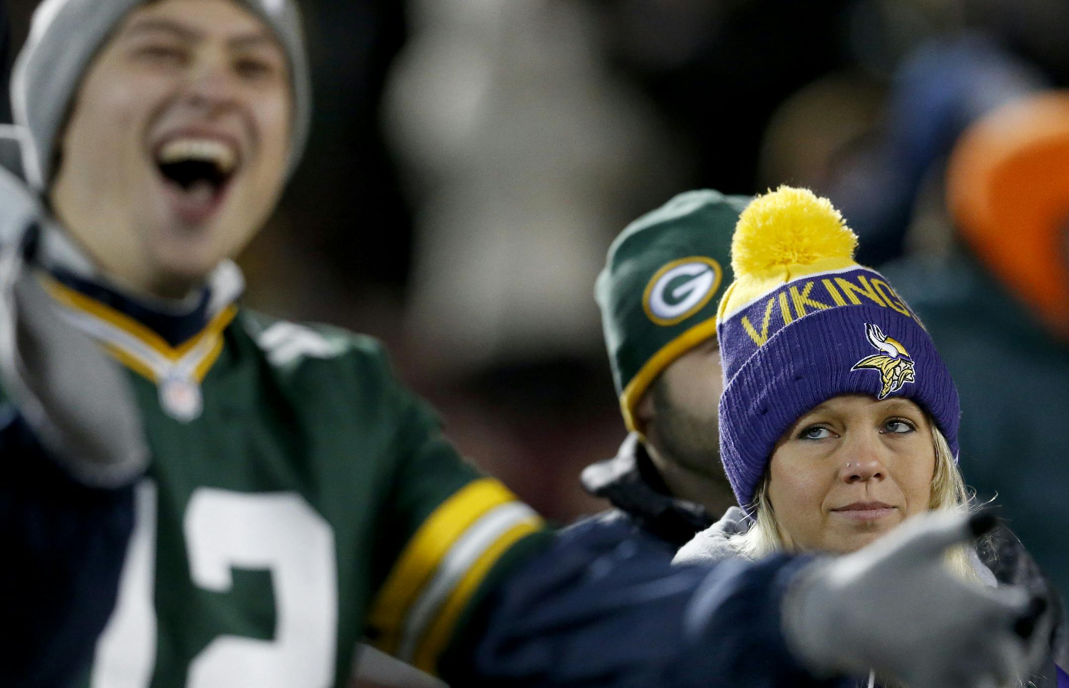 Green Bay Packers fan Mason 24, of Yankton South Dakota cheered at the end of the game as Minnesota Vikings fan Shelly Bye, 26, had a different expression. Green Bay beat Minnesota by a finals score of 30-13. ] CARLOS GONZALEZ ï cgonzalez@startribune.com - November 22, 2015, Minneapolis, MN, TCF Bank Stadium, NFL, Minnesota Vikings vs. Green Bay Packers ORG XMIT: MIN1511221902520690