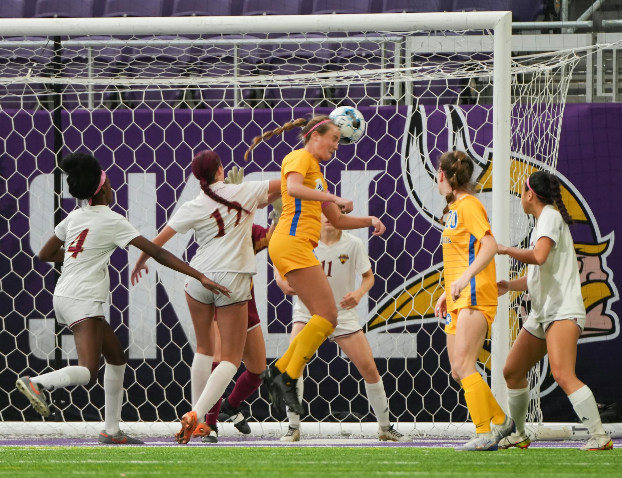 Wayzata Trojans forward Grace Estby (13) scores off a header against Maple Grove in the first half of a State Class 3A girls soccer semifinal match at U.S. Bank Stadium in Minneapolis, Minn., on Tuesday, Oct. 31, 2023. ] SHARI L. GROSS • shari.gross@startribune.com