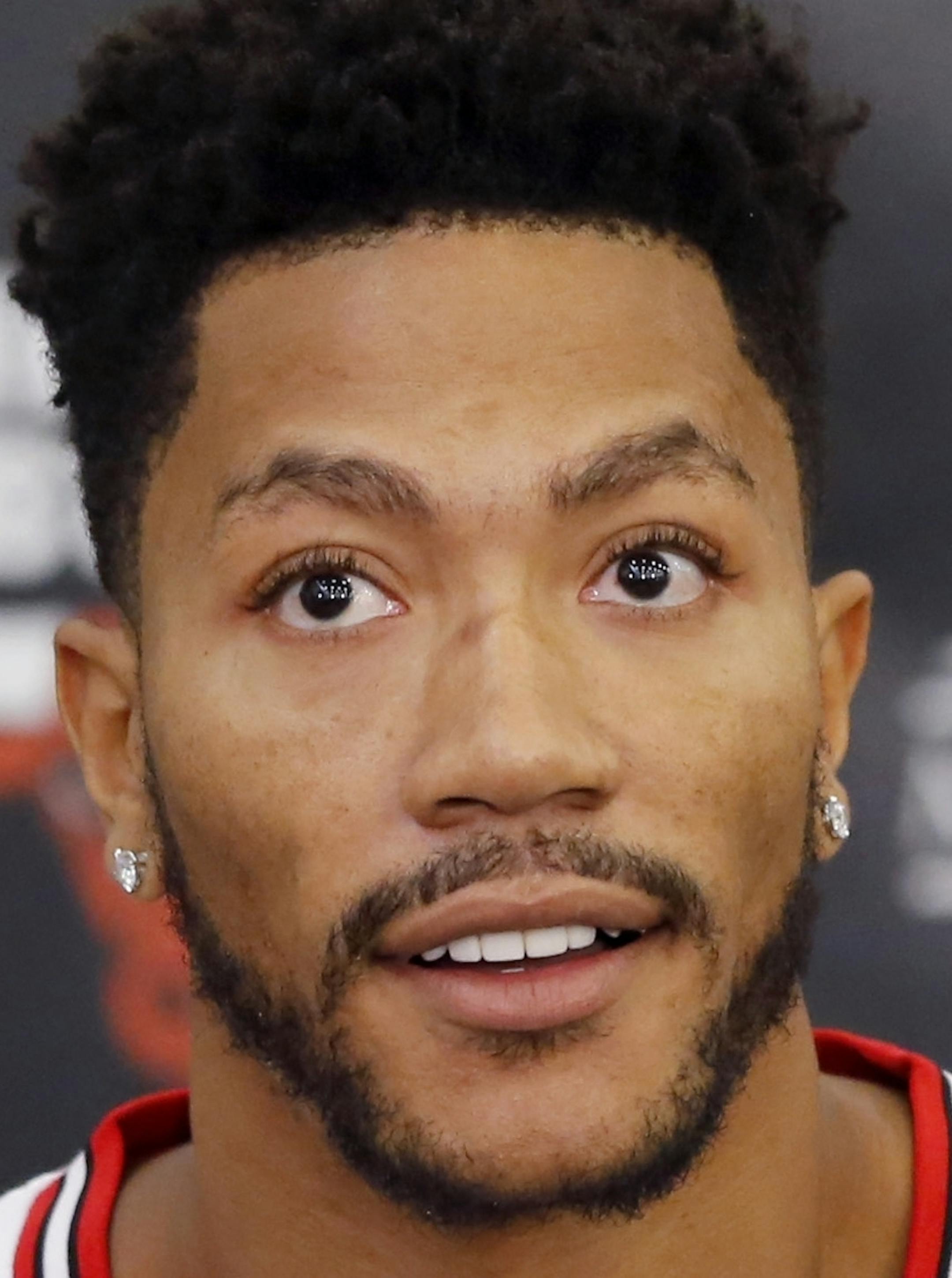 FILE - In this Sept. 28, 2015, file photo, Chicago Bulls' Derrick Rose sits down for an NBA basketball media day news conference in Chicago. Two people with knowledge of the deal say the New York Knicks are acquiring Rose from the Chicago Bulls. The Knicks are sending center Robin Lopez and guards Jose Calderon and Jerian Grant to Chicago, the people told The Associated Press on Wednesday, June 22, 2016 on condition of anonymity because the trade was not yet official.(AP Photo/Charles Rex Arboga