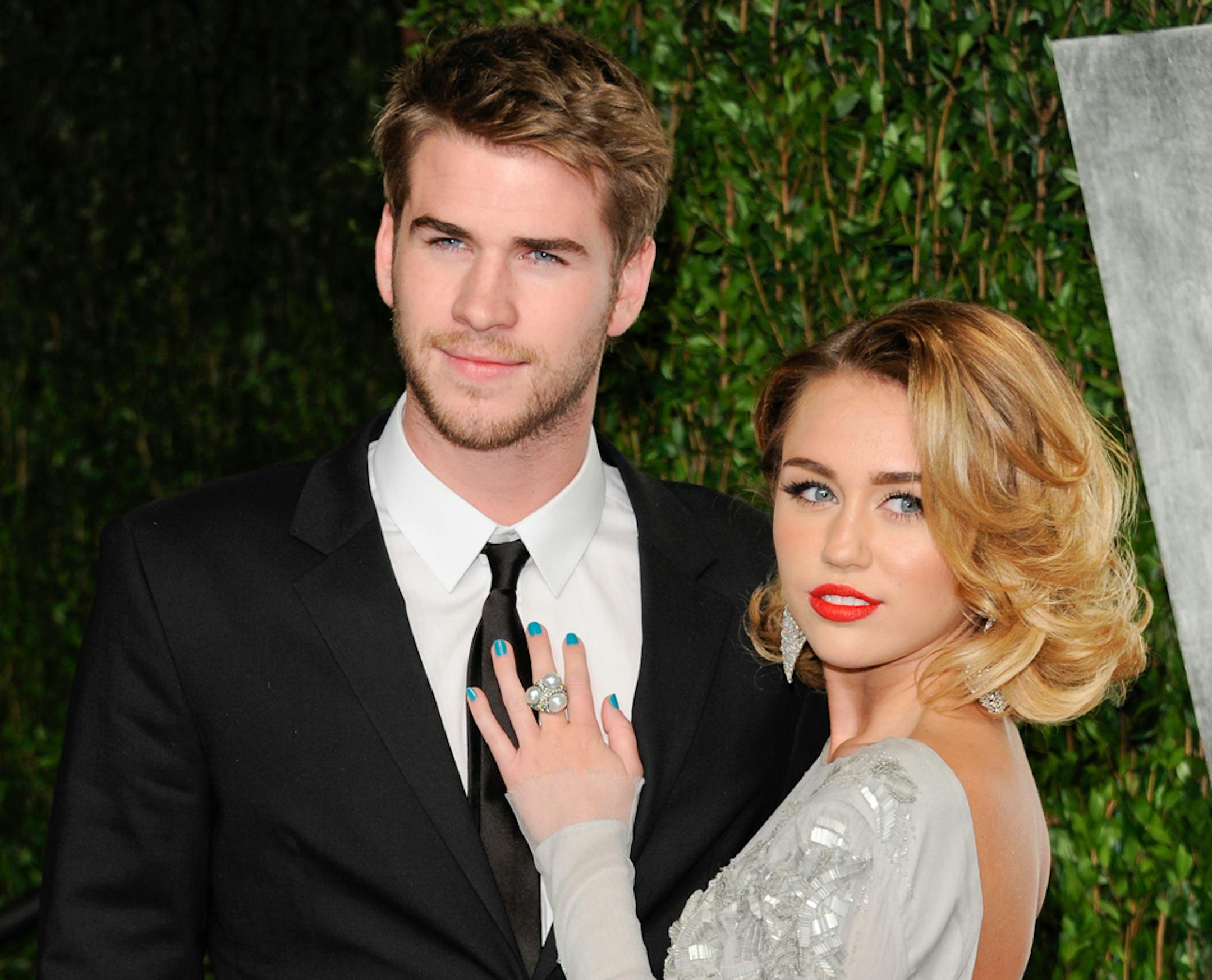 Miley Cyrus, right, and Liam Hemsworth