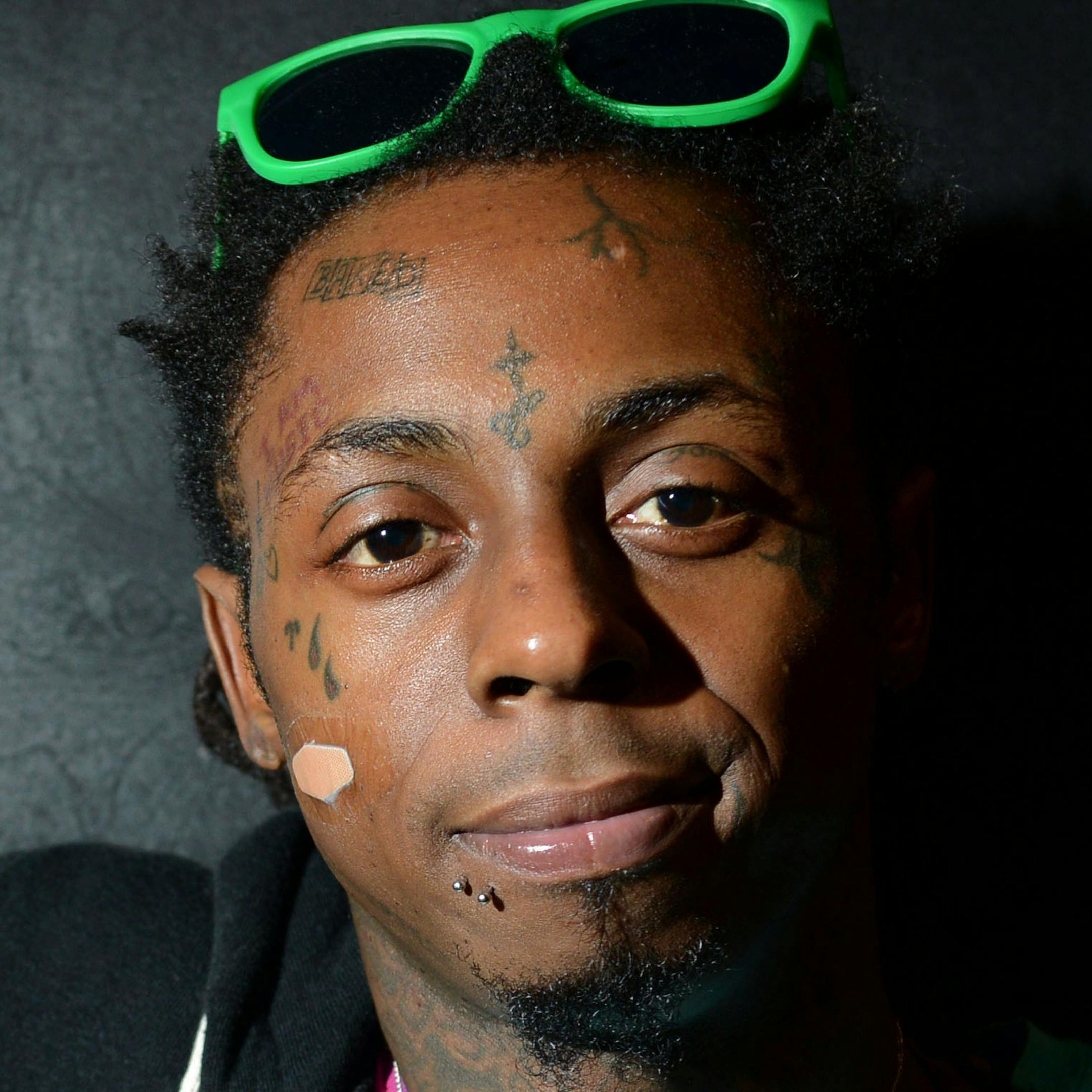 FILE - In this Feb. 1, 2013 file photo, recording artist Lil Wayne meets fans and celebrates his contemporary street wear apparel brand TRUKFIT at his hometown Macy's, in New Orleans. Lil Wayne is out of the hospital, according to his Young Money associate Mack Maine. Mack Maine told his Twitter followers on Monday night, March 18, 2013 that the multiplatinum rapper had left Cedars-Sinai hospital in Los Angeles, where he had been hospitalized since last week. (Photo by Jordan Strauss/Invision/AP