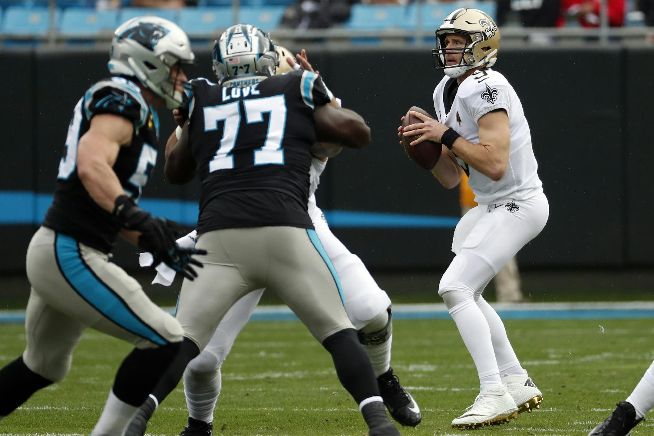 New Orleans Saints quarterback Drew Brees (9) looks to pass against the Carolina Panthers during the first half of an NFL football game in Charlotte, N.C., Sunday, Dec. 29, 2019. (AP Photo/Gerry Broome)