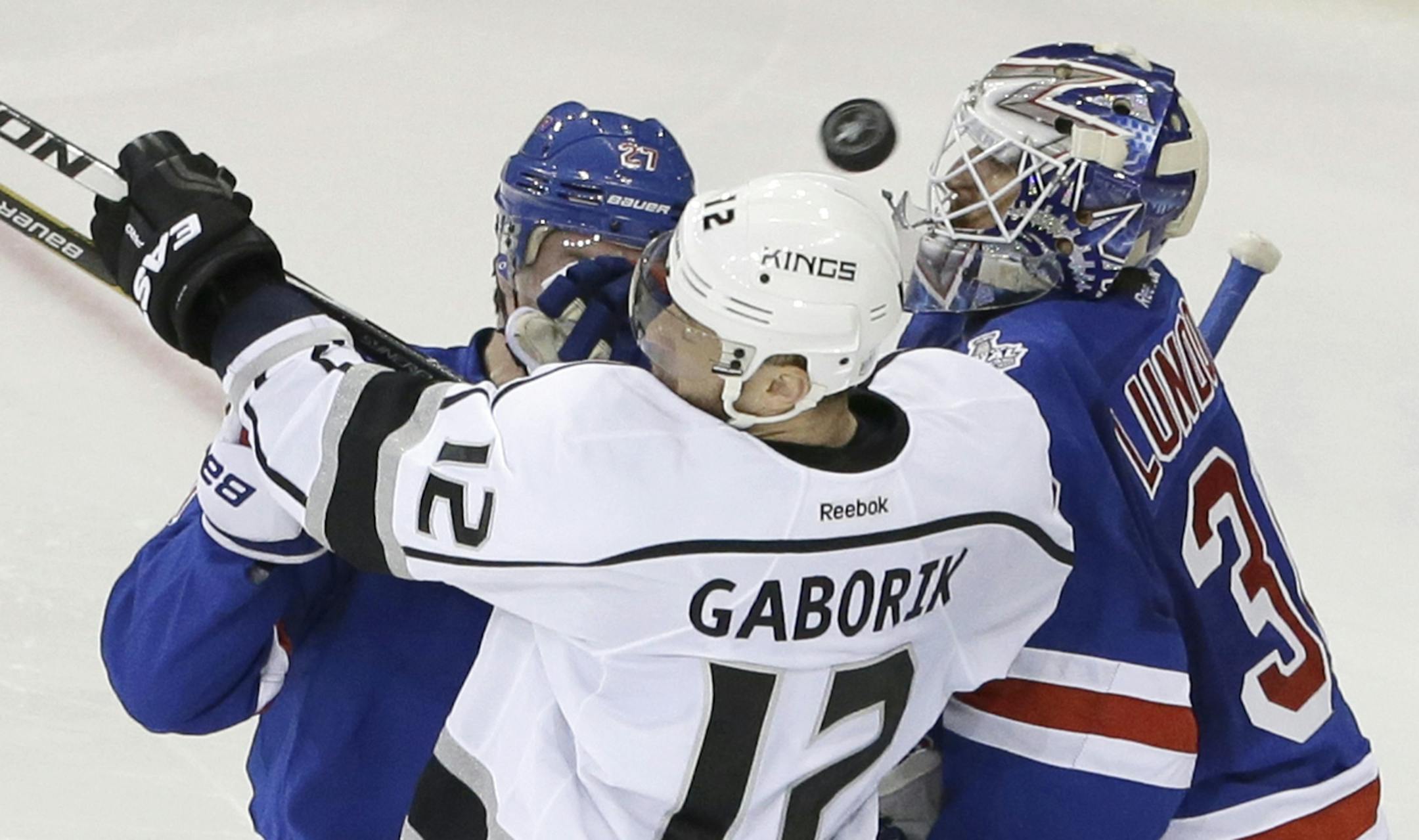 New York Rangers defenseman Ryan McDonagh (27) and Rangers goalie Henrik Lundqvist (30) defend against Los Angeles Kings right wing Marian Gaborik (12) in the second period during Game 3 of the NHL hockey Stanley Cup Final, Monday, June 9, 2014, in New York. (AP Photo/Frank Franklin II)