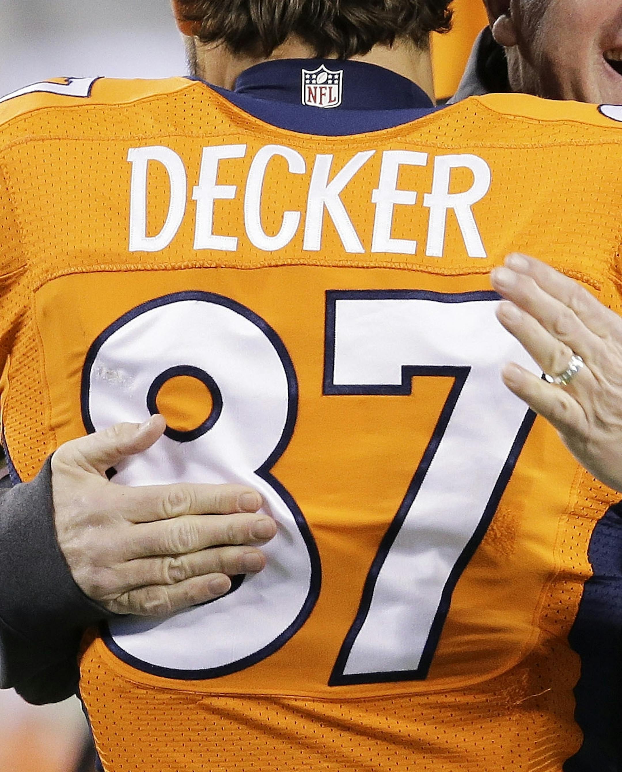 Denver Broncos head coach John Fox laughs as he talks to Eric Decker before the NFL Super Bowl XLVIII football game against the Seattle Seahawks Sunday, Feb. 2, 2014, in East Rutherford, N.J. (AP Photo/Chris O'Meara)