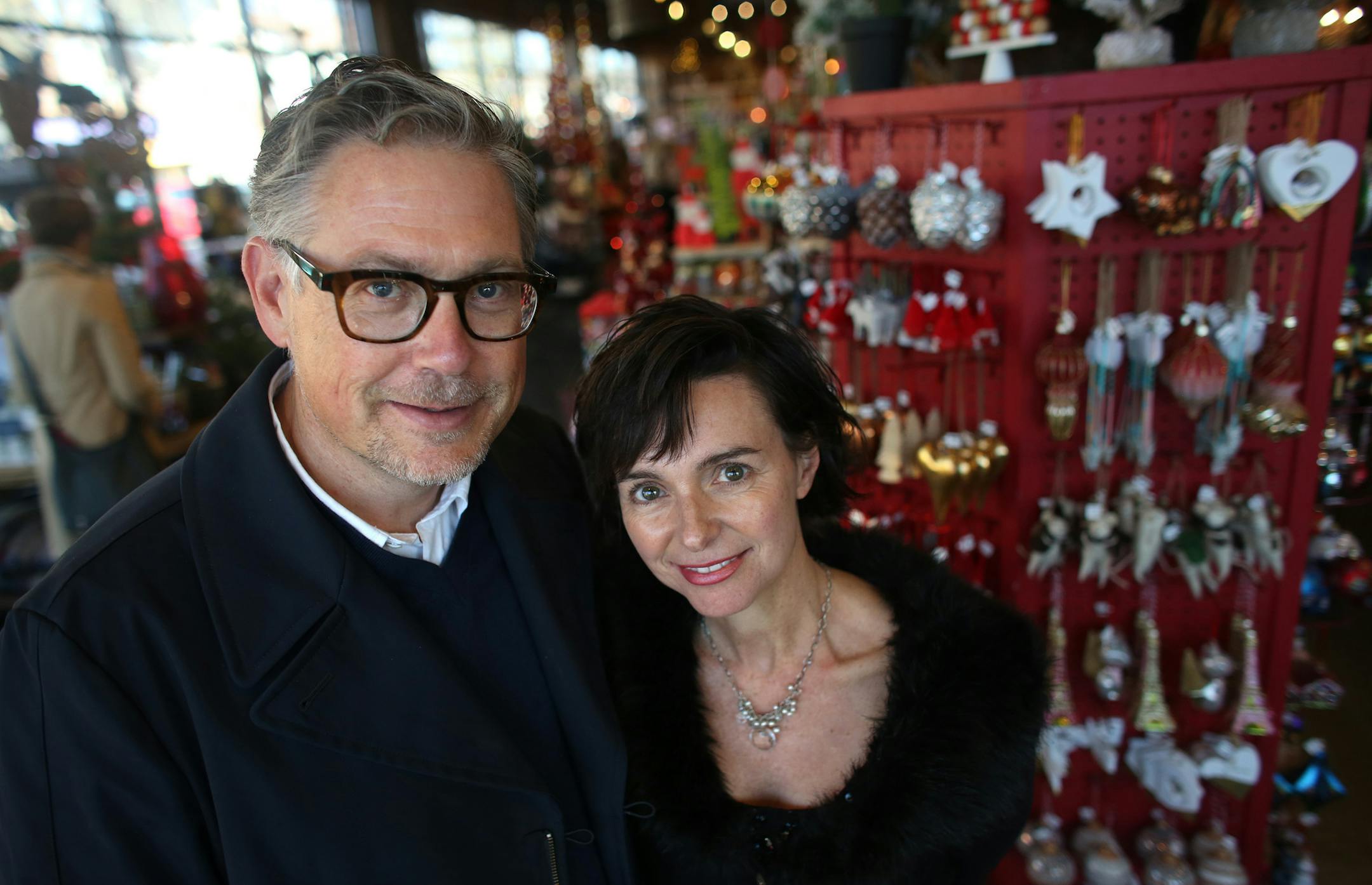 Owners of Patina, Christine Ward and Rick Haase stand among the holiday displays at one of their stores in Minneapolis.