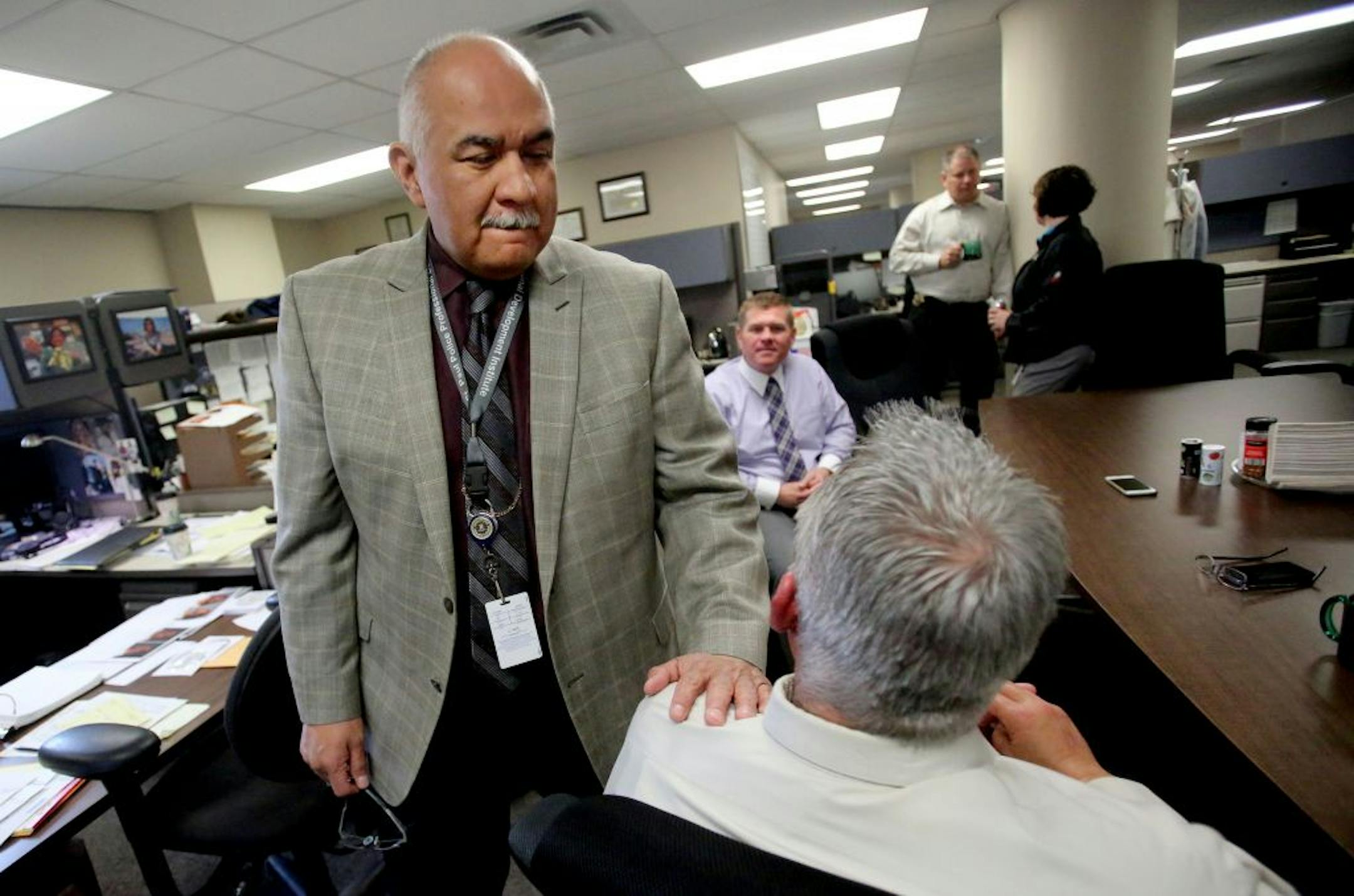 After a more than thirty year career in law enforcement St. Paul Assistant Police Chief Bill Martinez will soon retire. In the short term he is hoping to decompress, train his new golden lab puppy and spend more time with family. Martinez hopes, more than anything, that he will be remembered as a good man during his time on the force. He was seen making his morning rounds to greet officers and detectives Thursday, April 14, 2016, at the St. Paul Police Headquarters in St. Paul, MN.