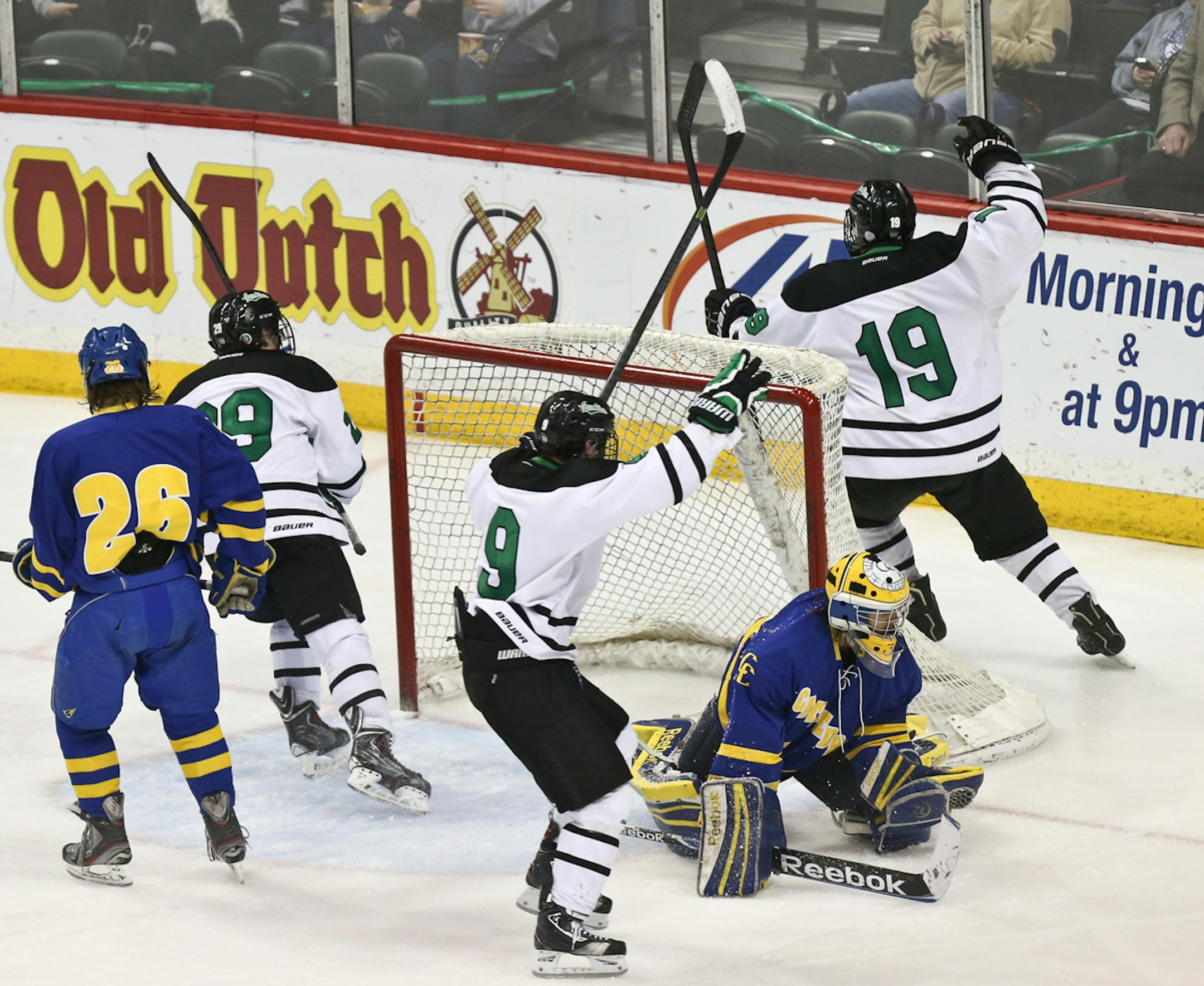 East Grand Forks players celebrated Tanner Tweten's (#19) winning point on St. Cloud Cathedral goalie Zach Fritz in the third period during the State Boys hockey Tournament 1A semifinals between St. Cloud Cathedral and East Grand Forks in St. Paul, Minn., on Friday, March 7, 2014. East Grand Forks won 2-1.