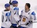 Finland's Teemu Selanne (8) talks with Mikko Koivu (9) and Saku Koivu (11) after beating Germany 5-0 in a preliminary round men's ice hockey game at t