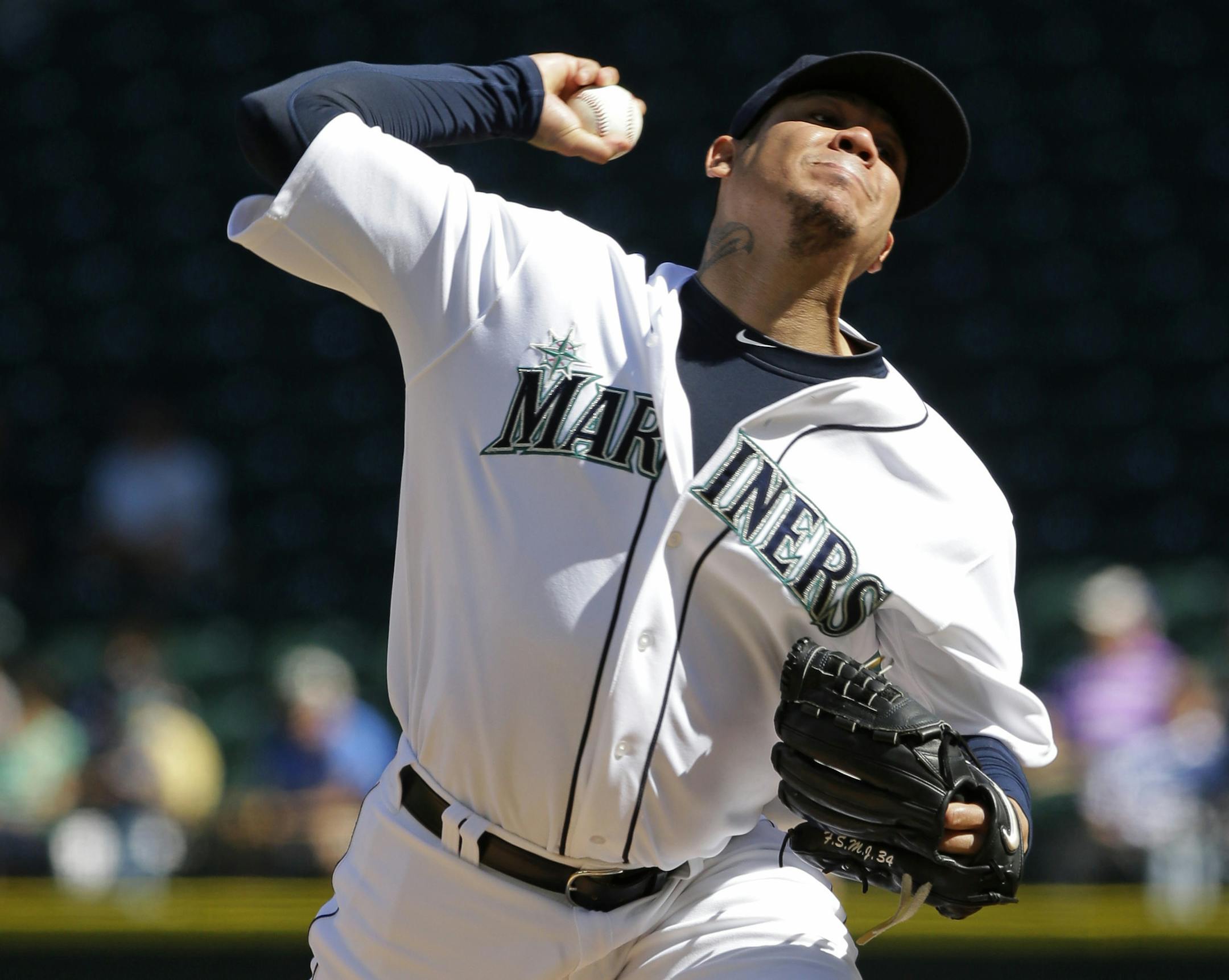 Seattle Mariners starting pitcher Felix Hernandez throws against the Texas Rangers in the fourth inning of a baseball game, Thursday, Sept. 10, 2015, in Seattle. (AP Photo/Ted S. Warren)