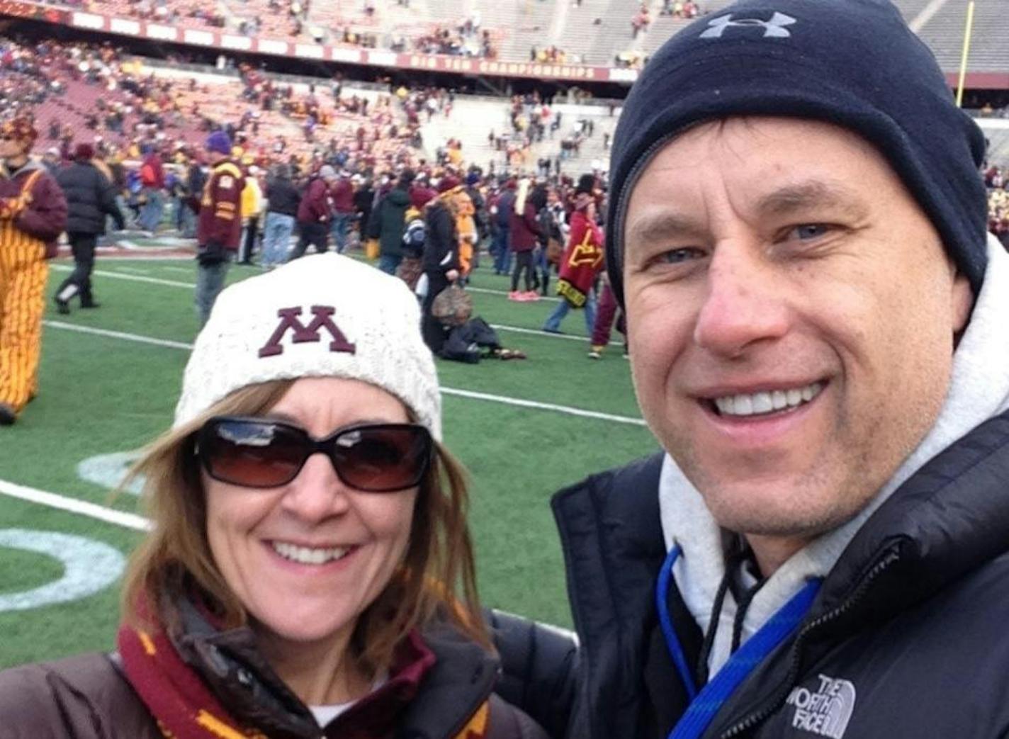 selfie photo of man and woman at football game