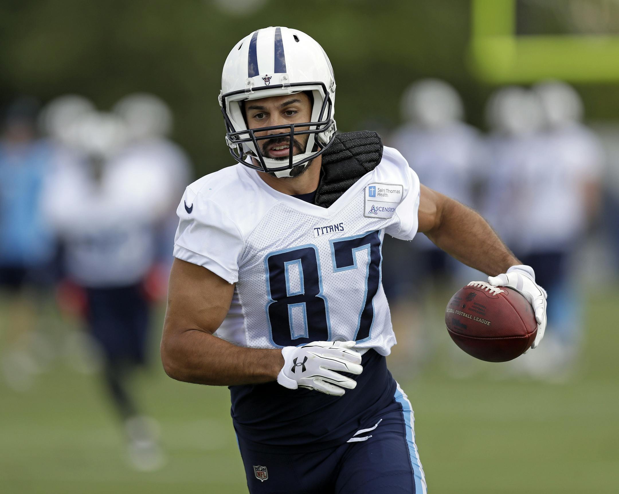 Tennessee Titans wide receiver Eric Decker runs a play during NFL football training camp Tuesday, Aug. 8, 2017, in Nashville, Tenn. (AP Photo/Mark Humphrey)