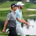 Matthew Wolff and Collin Morikawa talk and share a laugh as they walk down the 17th fairway during the final round of the 2019 3M Open. Morikawa won t