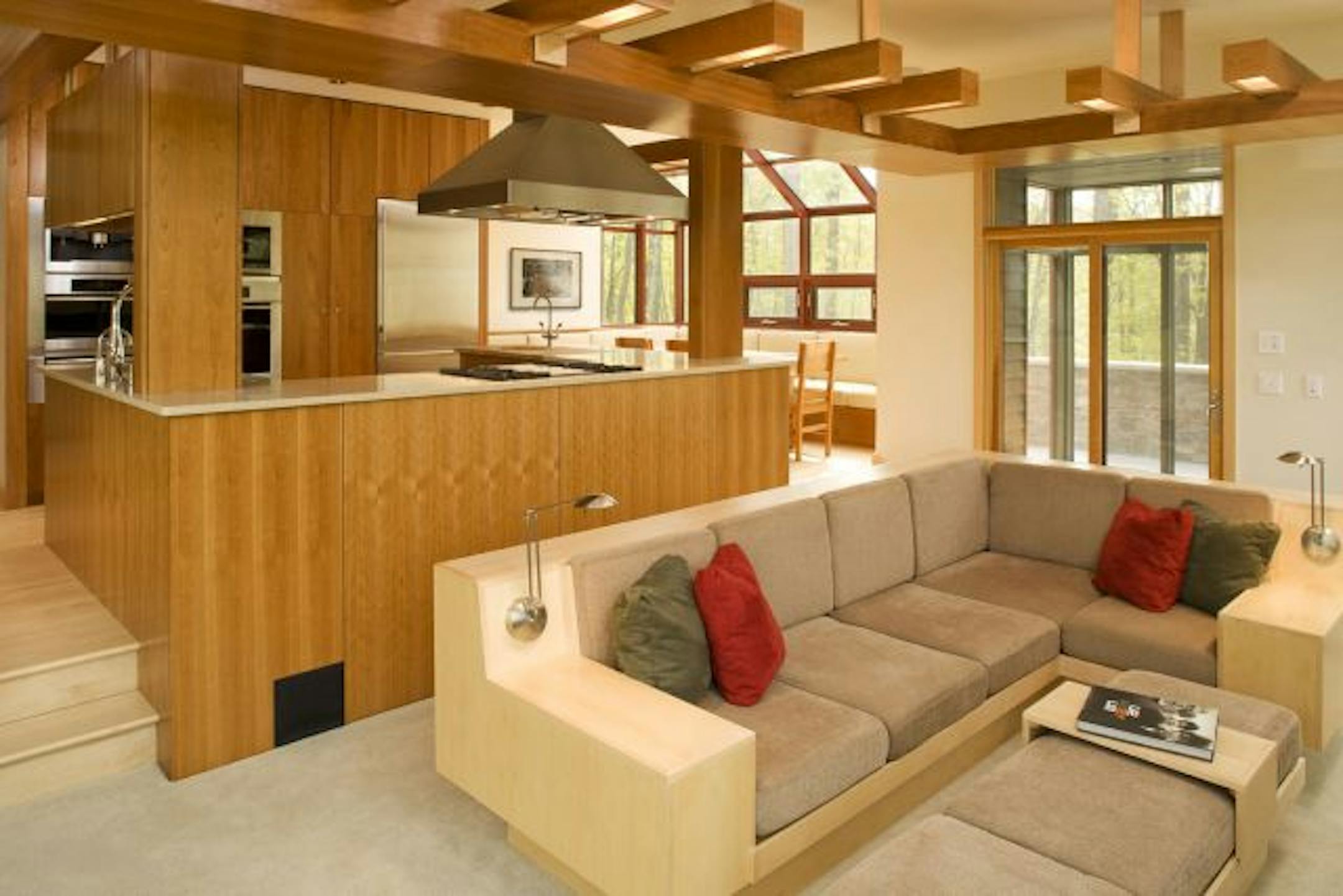 A look at the living room and kitchen of a lake home designed by SALA.