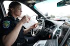 Eagan police officer Kirsten Dorumsgaard printed off a ticket for a motorist who was spotted typing on a phone during a 2019 enforcement effort agains