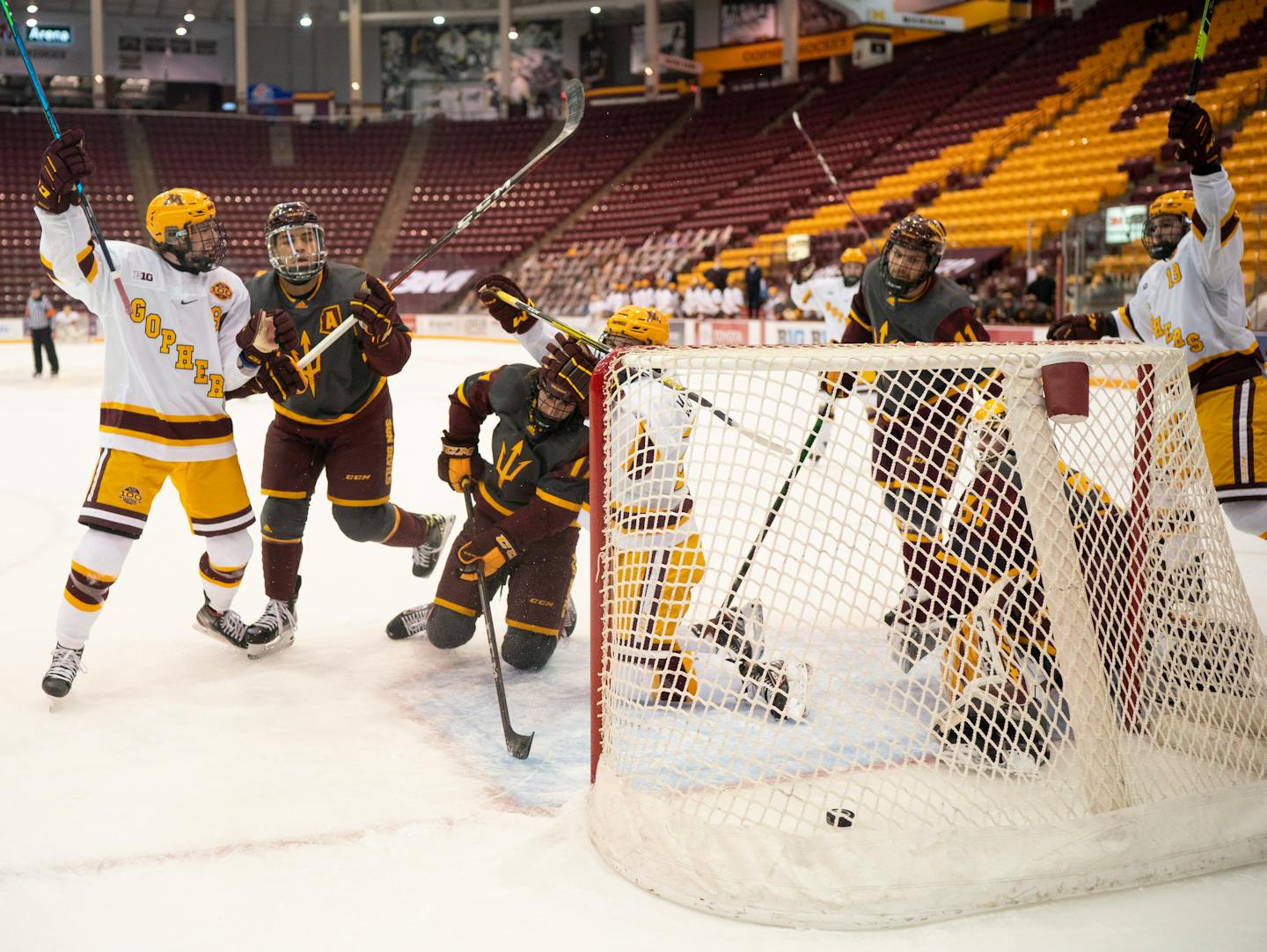 Minnesota Gophers center Sammy Walker (9), Gophers left wing Blake McLaughlin (27), and Gophers right wing Scott Reedy (19) celebrate McLaughlin's first period goal. ] JEFF WHEELER • jeff.wheeler@startribune.com