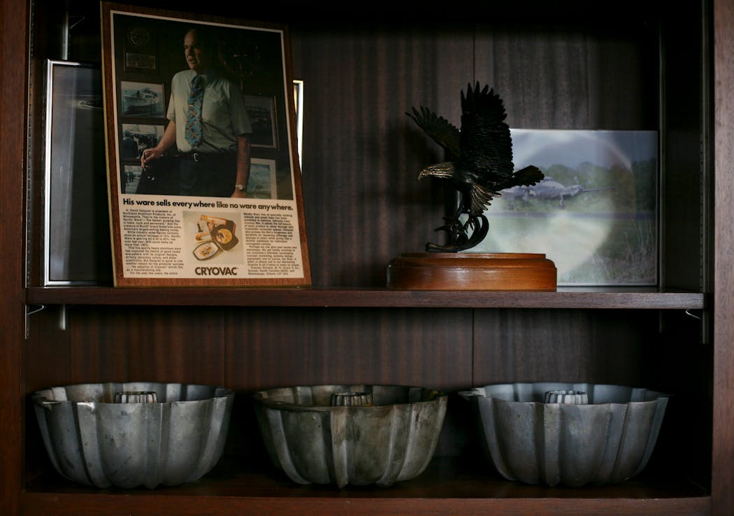 Original heavy-duty aluminum bundt pans sat on a shelf in Dottie Dalquist's Nordic Ware office in 2006.