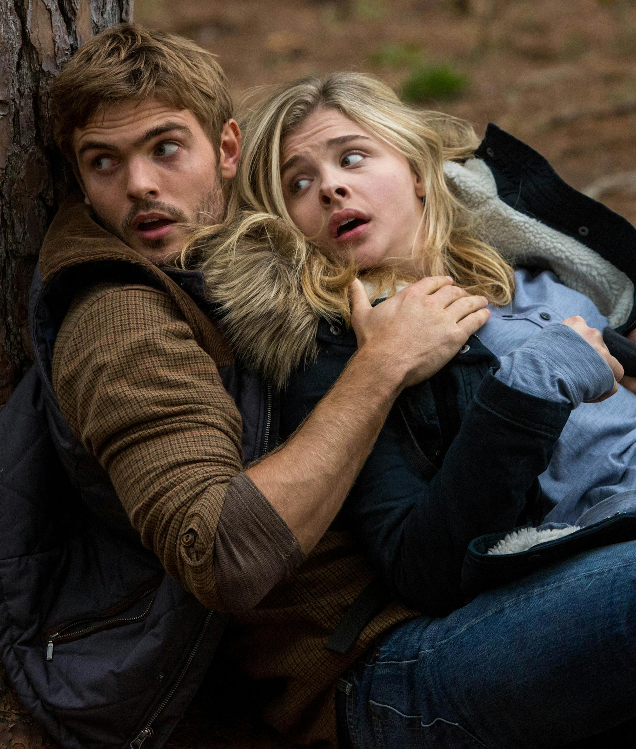 This photo provided by Sony Pictures Entertainment shows, Alex Roe, left, as Evan Walker and Chloe Grace Moretz as Cassie Sullivan in a scene from the Columbia Pictures release, "The Fifth Wave." The movie opens in U.S. theaters on Jan. 22, 2016. (Chuck Zlotnick/Sony/Columbia Pictures via AP)