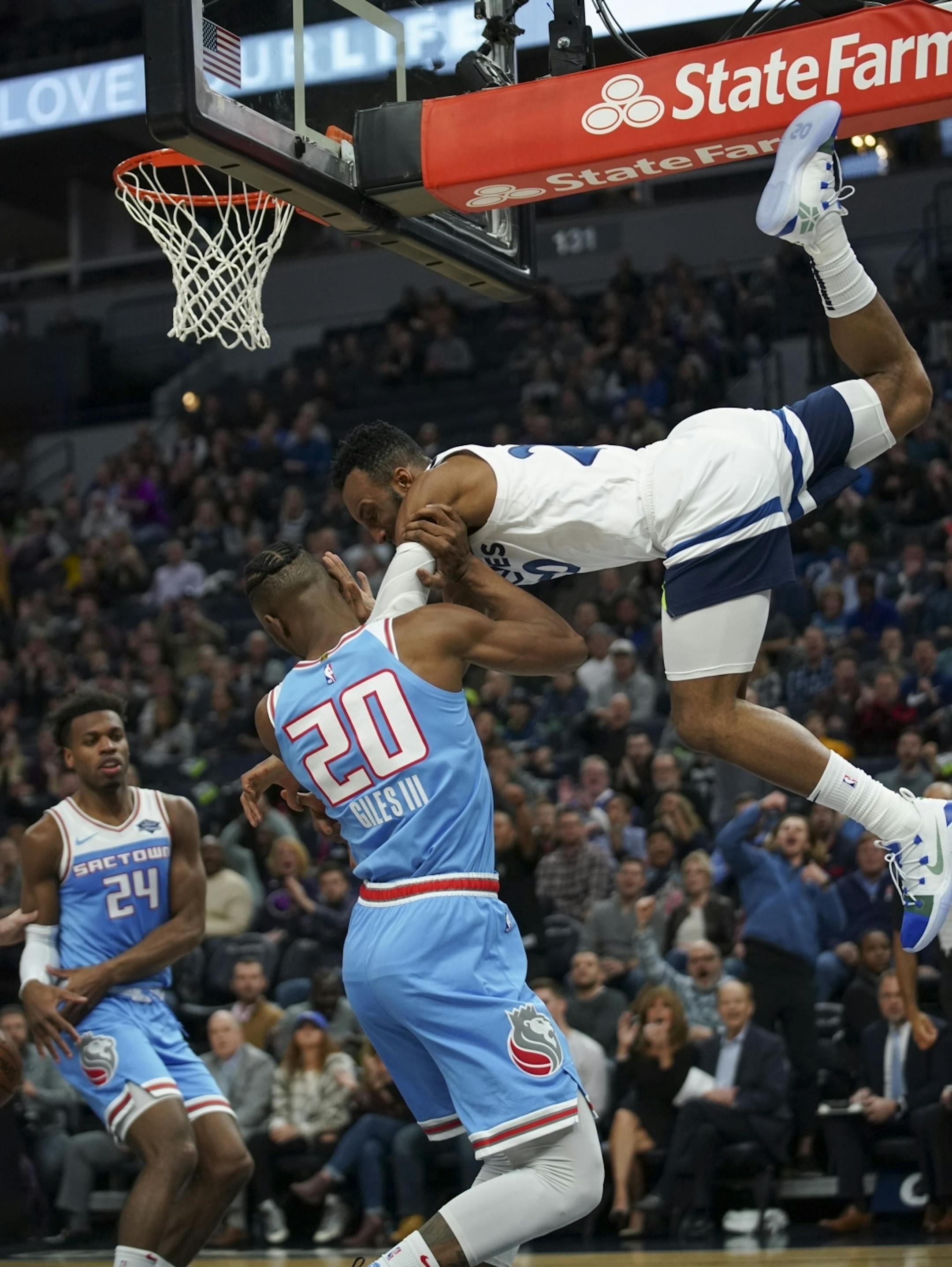 Minnesota Timberwolves guard Josh Okogie (20) made a spectacular descent from the hoop after dunking in the second quarter on Sacramento Kings forward Harry Giles (20).
