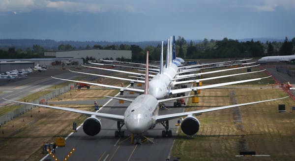 A line of Boeing 787 Dreamliners waiting to be delivered are shown on a closed runway on Tuesday, June 18, 2013 at Paine Field near Boeing's Everett, 