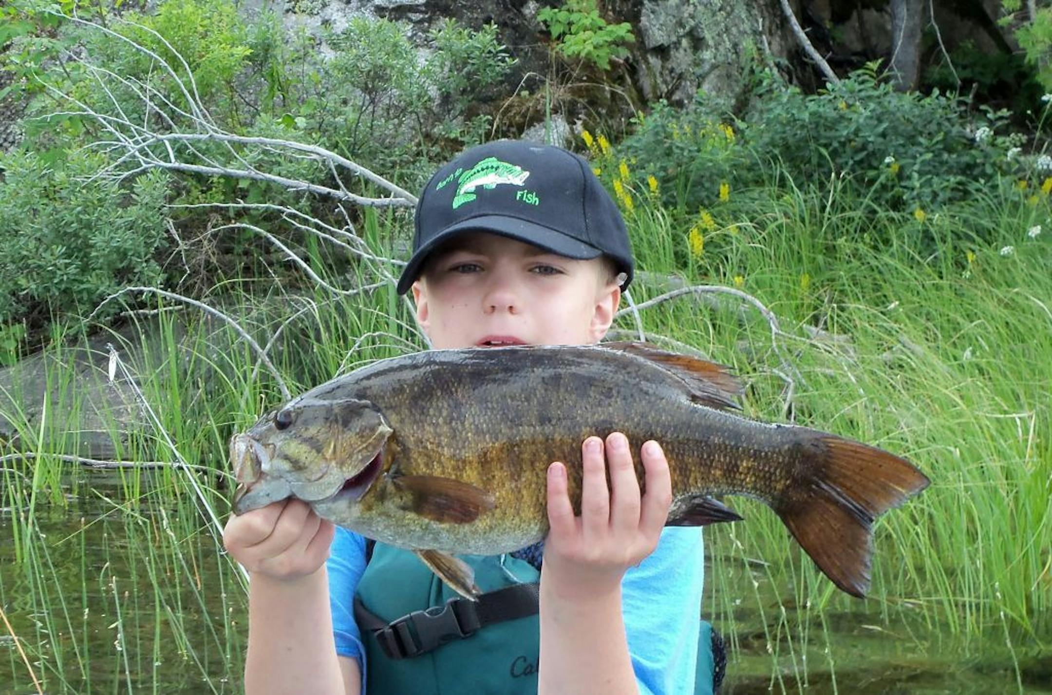 BWCA bass: Simon Prescott, 10, of Minneapolis, caught this huge smallmouth bass on the Granite River in the BWCA near the end of a rapids using a small Rapala. "We had no tape or scale, but Simon estimates that it was about 20 inches,'' said dad, Scott. "We paddled over to show our canoeing partners and let it go."