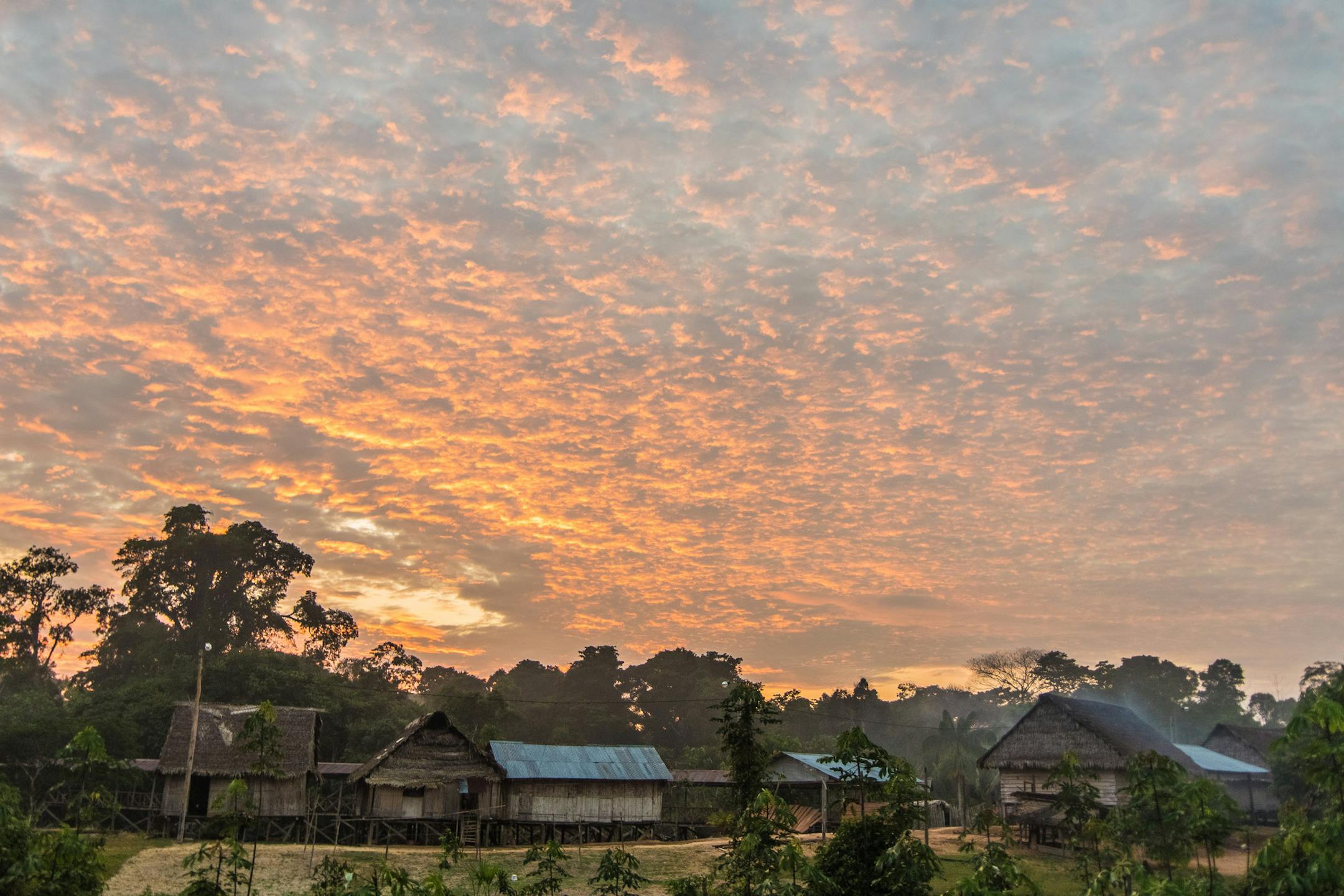 The sun rises over Buen Peru, a small Mats&#x17d;s village near the Brazilian border in the Peruvian Amazon. Sunrise in the Mats&#x17d;s village of Buen Peru. To reach the village, the author flew from Iquitos to Angamos aboard a Peruvian military aircraft and then traveled down the Javary River for eight hours aboard a propeller-driven dugout canoe.