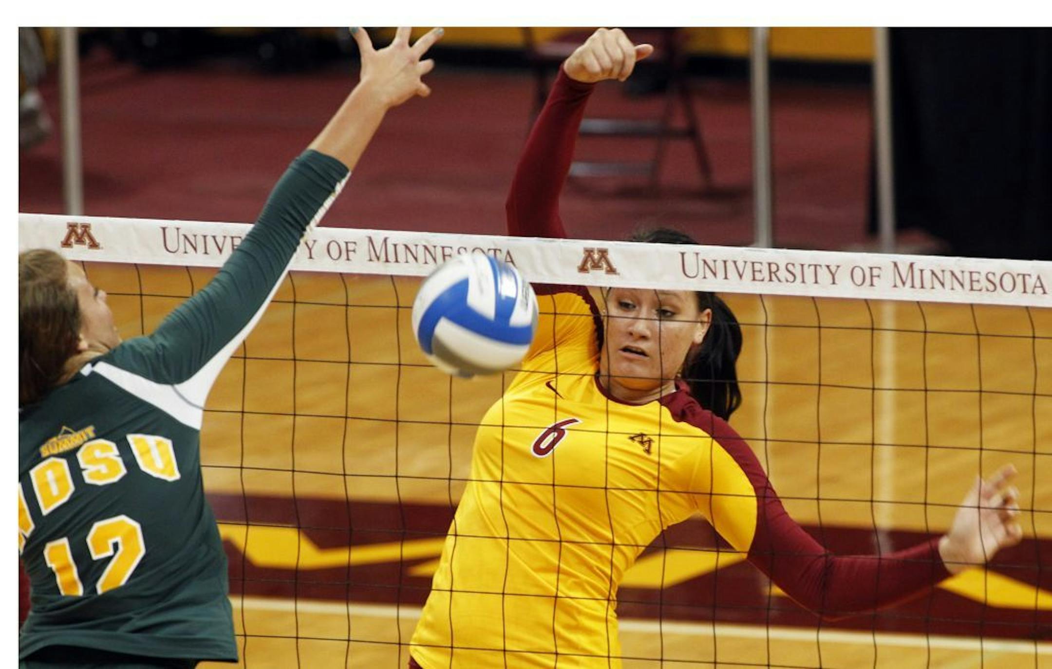 Tori Dixon tipped the ball over the net for a Minnesota point.