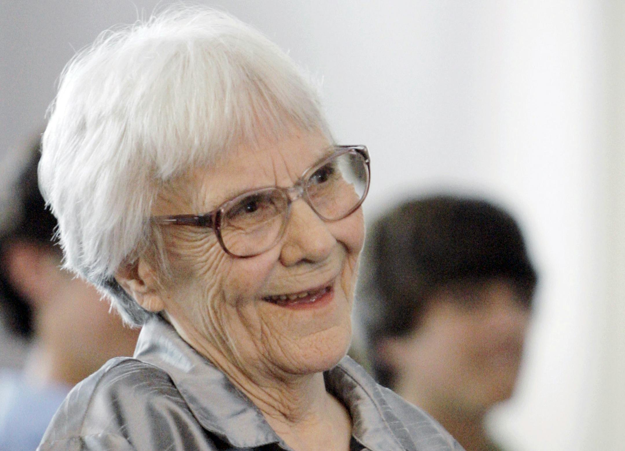 FILE - In this Aug. 20, 2007 file photo, "To Kill A Mockingbird" author Harper Lee smiles during a ceremony honoring the four new members of the Alabama Academy of Honor, at the state Capitol in Montgomery, Ala. The ascendance of Tonja Carter, who worked in Lee's older sister Alice Leeís law office before going to the University of Alabama law school, graduating in 2006 and becoming her partner, brought more aggressive legal tactics on Harper Leeís behalf. (AP Photo/Rob Carr, File) ORG
