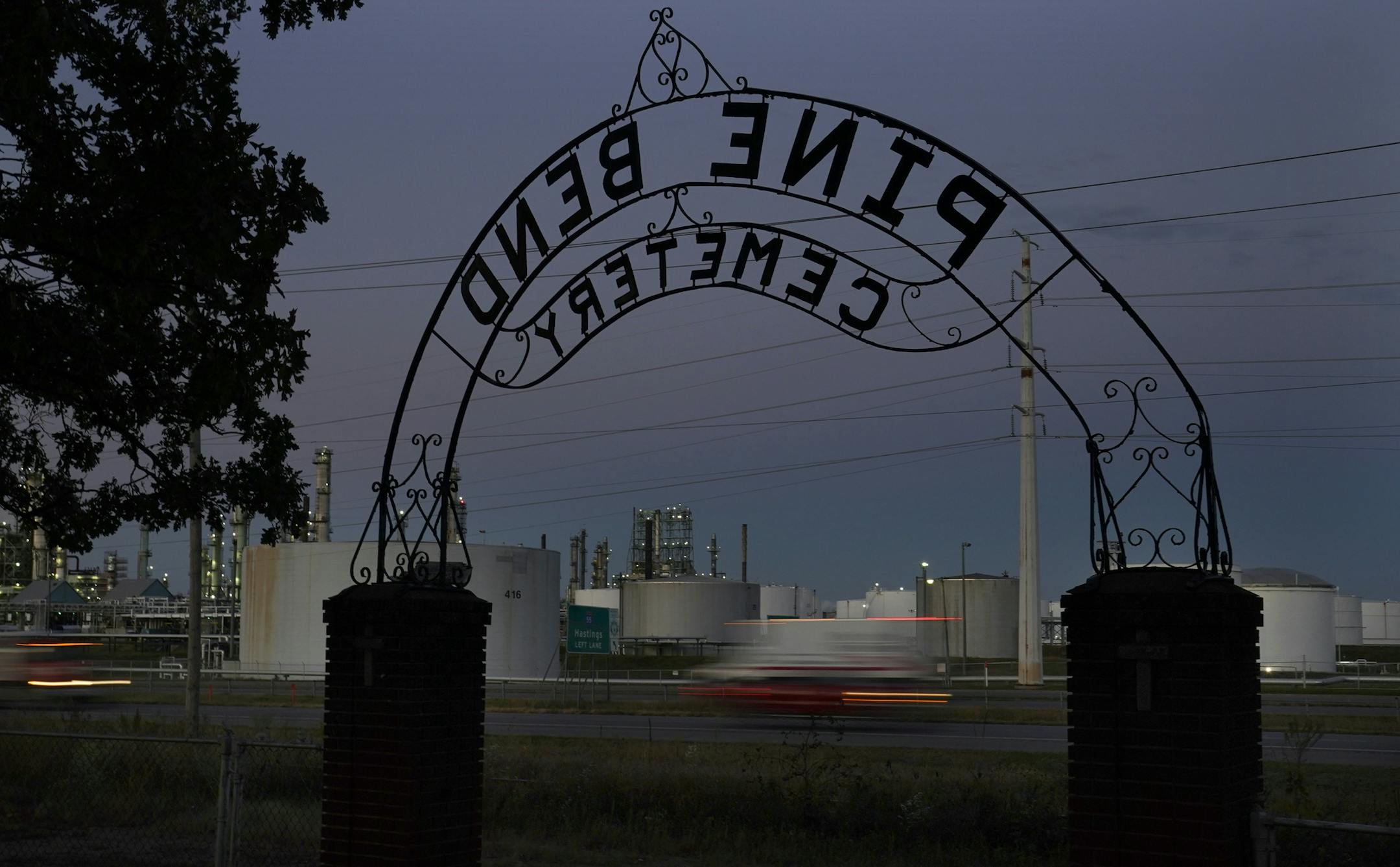 The Pine Bend Cemetery entrance sign frames nearby Pine Bend Refinery, owned by Koch Industries, and traffic along Highway 52. Pine Bend Refinery has grown and company property now surrounds the cemetery, making access to the cemetery difficult and its future uncertain and seen Tuesday, Oct. 6, in Rosemount. ] DAVID JOLES • david.joles@startribune.com Wednesday, Oct. 21, 2020 in Minneapolis, MN. east burb story