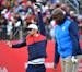 23 time Olympic gold medalist Michael Phelps stretched as retired English Olympic sprinter John Regis set up his shot at the first tee during the Ryde