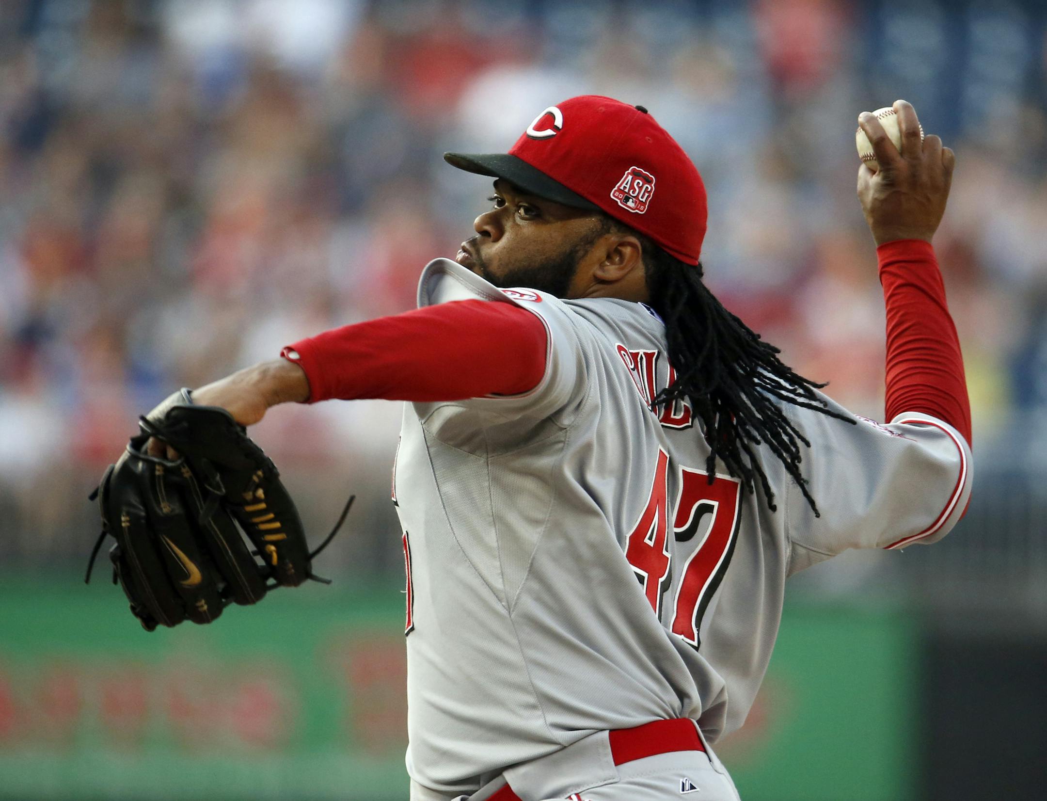 Cincinnati Reds starting pitcher Johnny Cueto throws during the first inning of a baseball game against the Cincinnati Reds at Nationals Park, Tuesday, July 7, 2015, in Washington. (AP Photo/Alex Brandon)