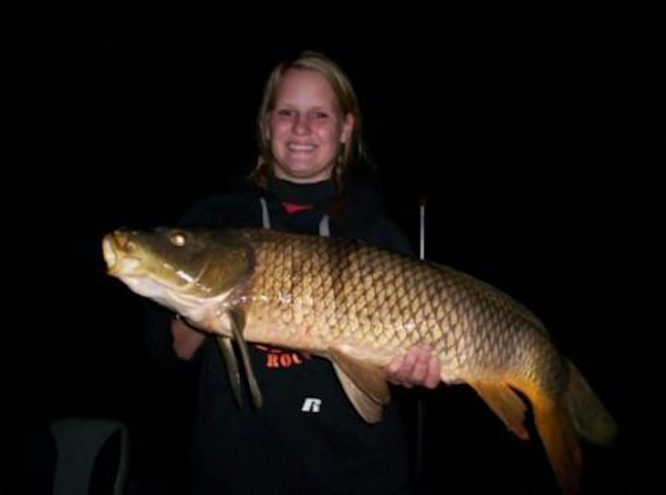 16 year old Kendra Veaze from Dent, MN with a 17.6 lbs common carp on her first night bowfishing trip.