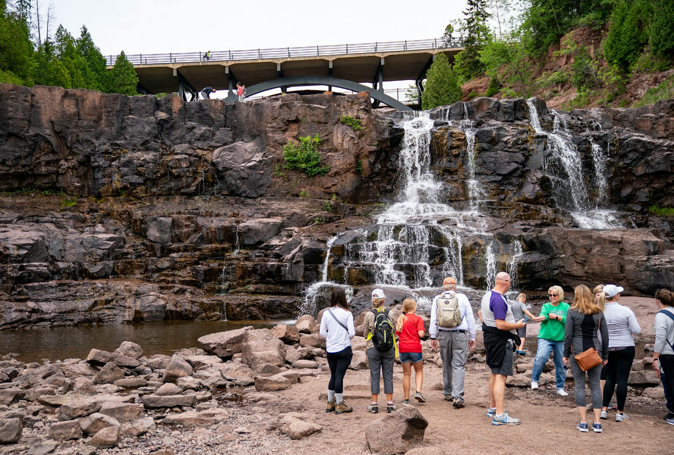 Visitors took pictures of the still flowing section of Gooseberry Falls State Park on Wednesday, July 21, 2021. Sections of the falls have dried out because of the drought that has plagued the Midwest this summer.