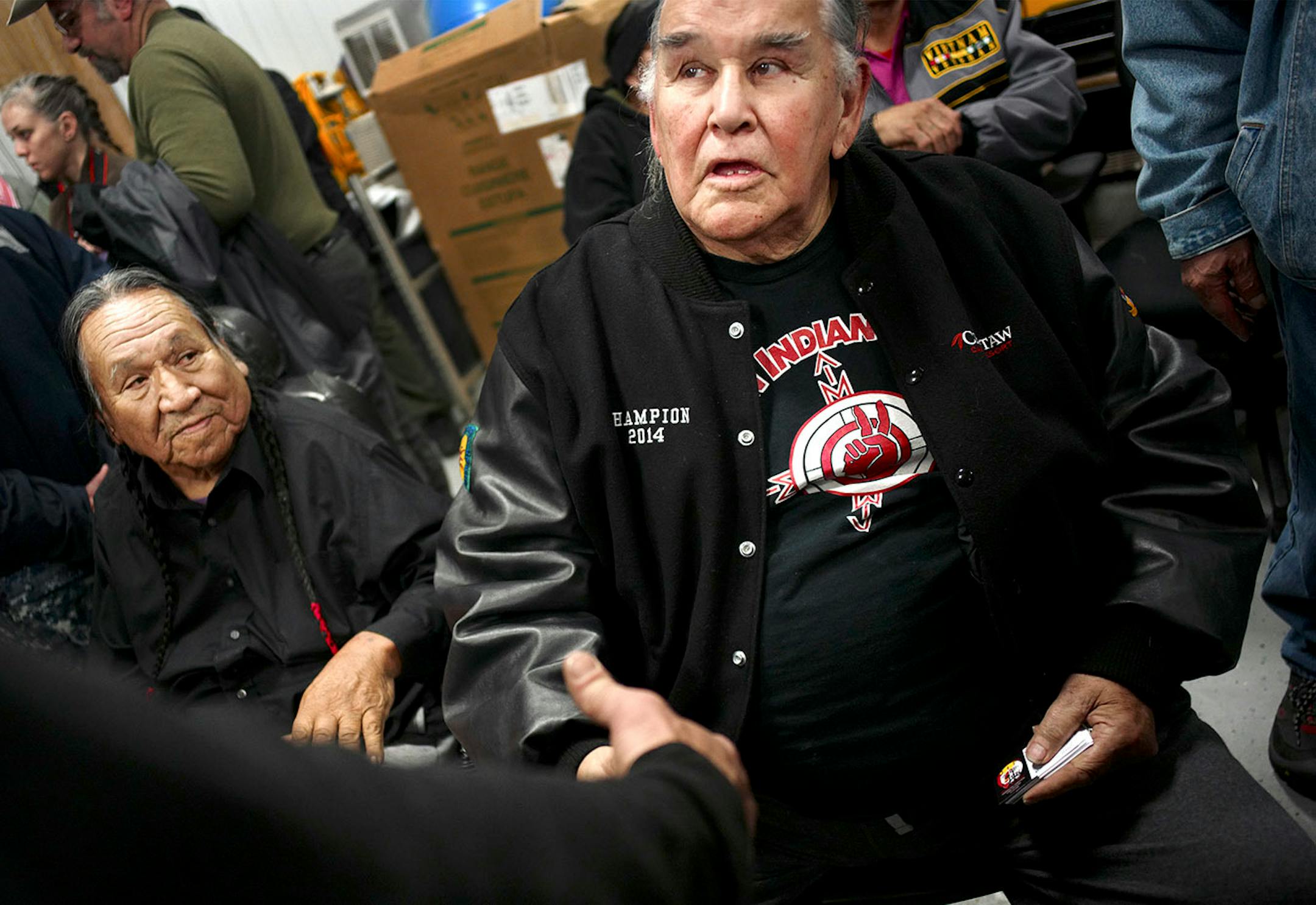 Leonard Crow Dog and Clyde Bellecourt, two of the founding members of the American Indian Movement, greeted veterans after an orientation at Sitting Bull College in Fort Yates, N.D., where veterans arrived at Standing Rock Reservation.
