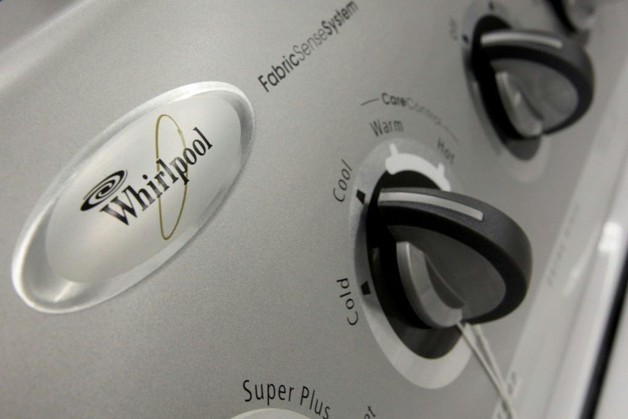 In this July 23, 2008 file photo, a Whirlpool washing machine on the Singers showroom floor in Philadelphia, is shown. Home appliance maker Whirlpool Corp. on Tuesday, March 10, 2009, reaffirmed its better-than-expected full-year earnings outlook.