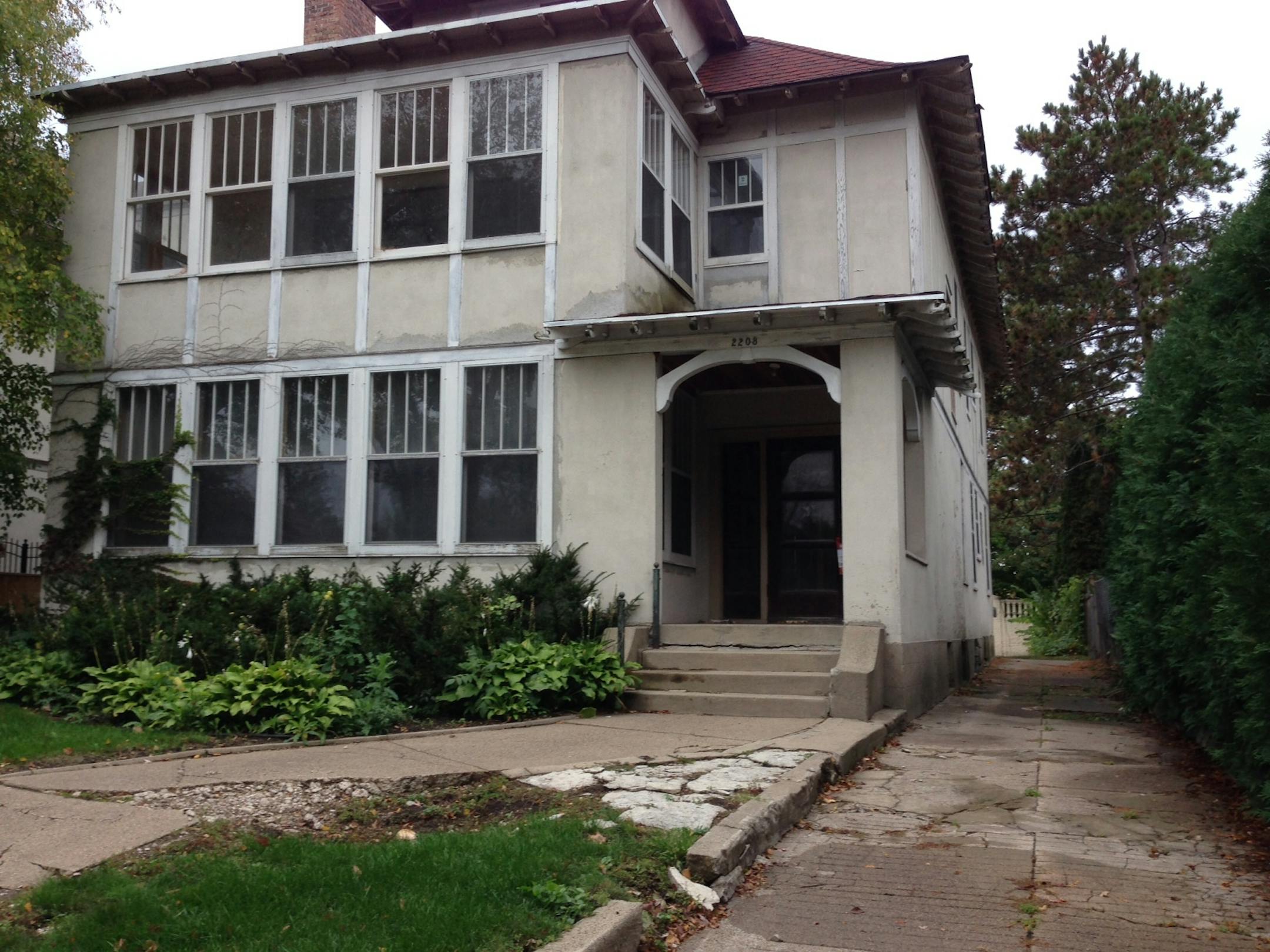 Crumbling concrete and peeling paint mark this long-vacant duplex in the East Isles neighborhood owned by developer Ross Fefercorn.