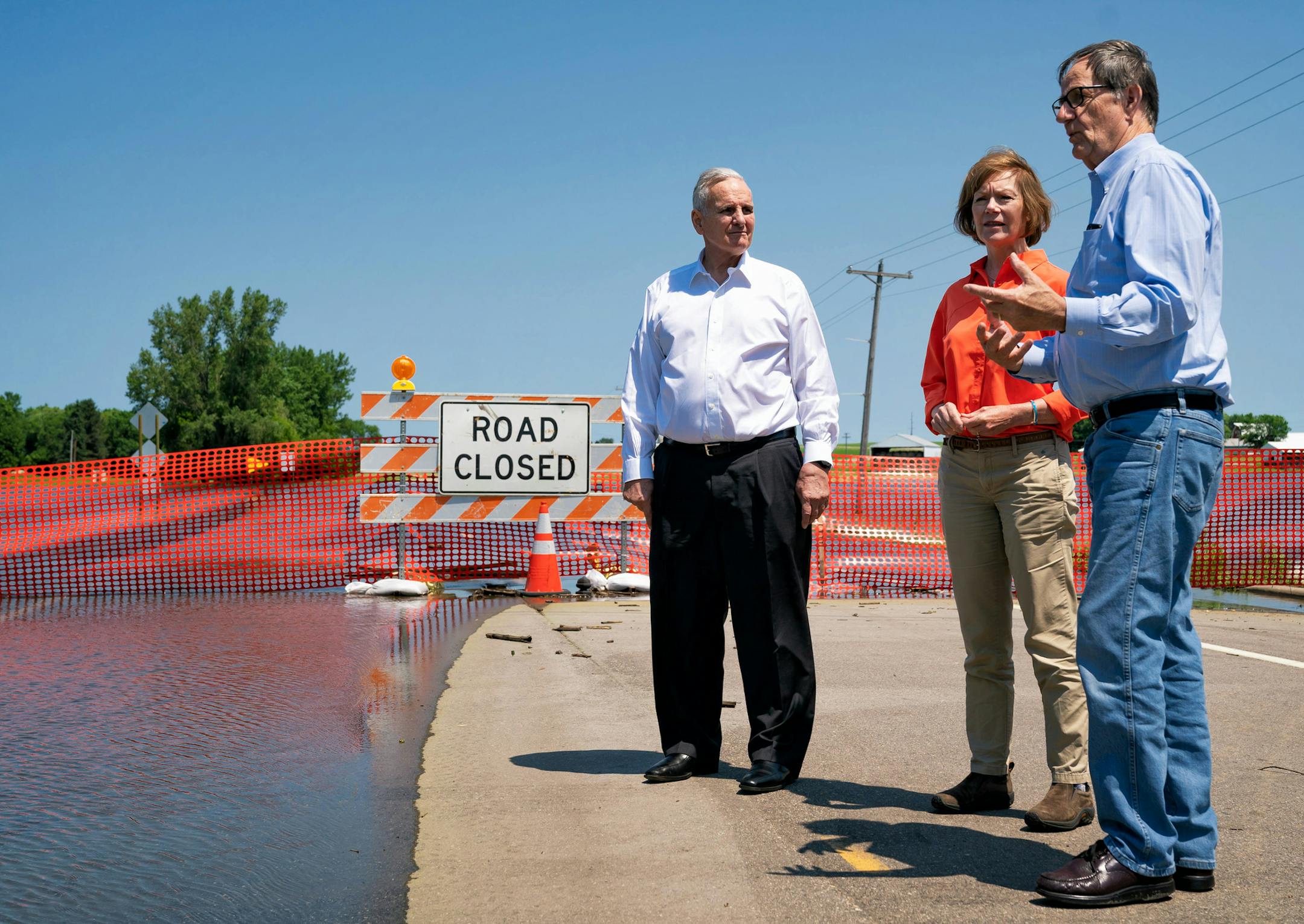 (CORRECTS LOCATION AND ID OF AG COMMISSIONER) Minnesota Governor Mark Dayton, left, and Minnesota Senator Tina Smith spoke with Commissioner of the Minnesota Department of Agriculture David Frederickson in Currie, MN, one of the hardest hit areas in recent flooding in Southwestern Minnesota. ] GLEN STUBBE • glen.stubbe@startribune.com Friday, July 6, 2018 On Friday, Gov. Mark Dayton visits southern Minnesota cities hit hardest by rainfall and flooding earlier this week. No one has calcula
