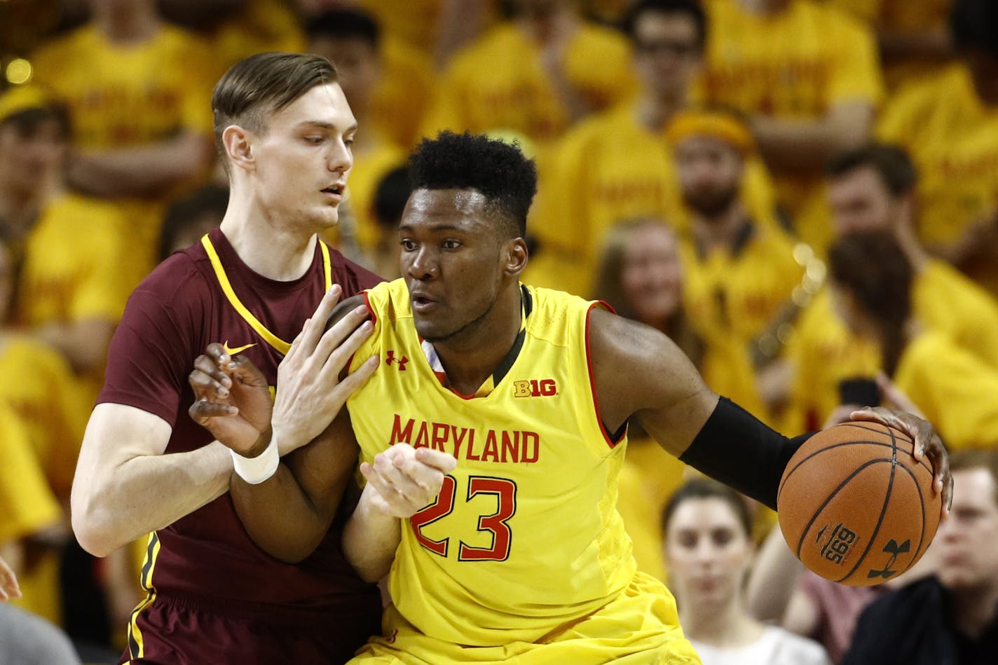 Maryland forward Bruno Fernando, right, of Angola, drives against Minnesota center Matz Stockman, of Norway, in the first half of an NCAA college basketball game, Friday, March 8, 2019, in College Park, Md. (AP Photo/Patrick Semansky)