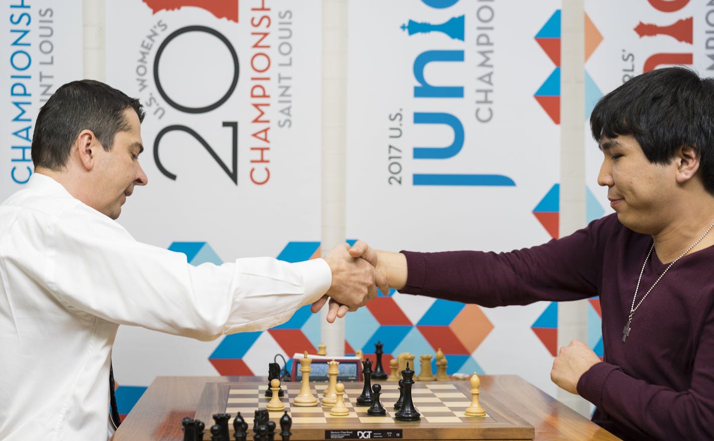 Grandmaster Alexander Onischuk, left, agrees to a draw with grandmaster Wesley So, 23, of Minnetonka, Minn. in the second of two playoff games for the U.S. Chess Championship at the Chess Club and Scholastic Center of St. Louis on Monday April 10, 2017. Photo provided by Lennart Ootes/Chess Club and Scholastic Center of St. Louis