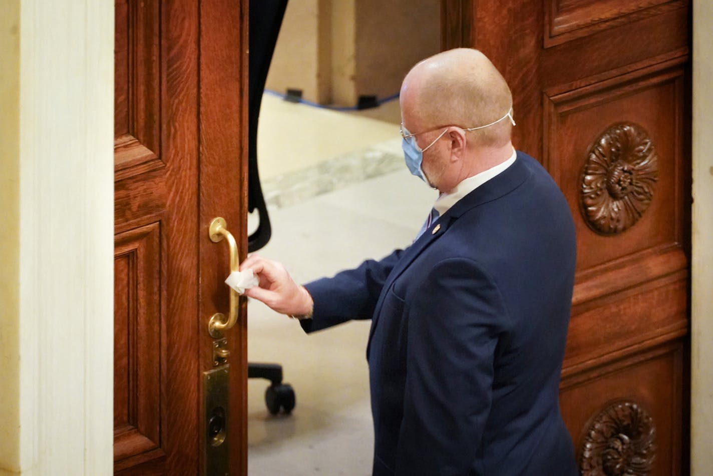 House Chief Sergeant-at-Arms Bob Meyerson disinfected the door handles of the House Chamber each time he saw someone touch them on Sunday, May 17, the last day of the regular legislative session.