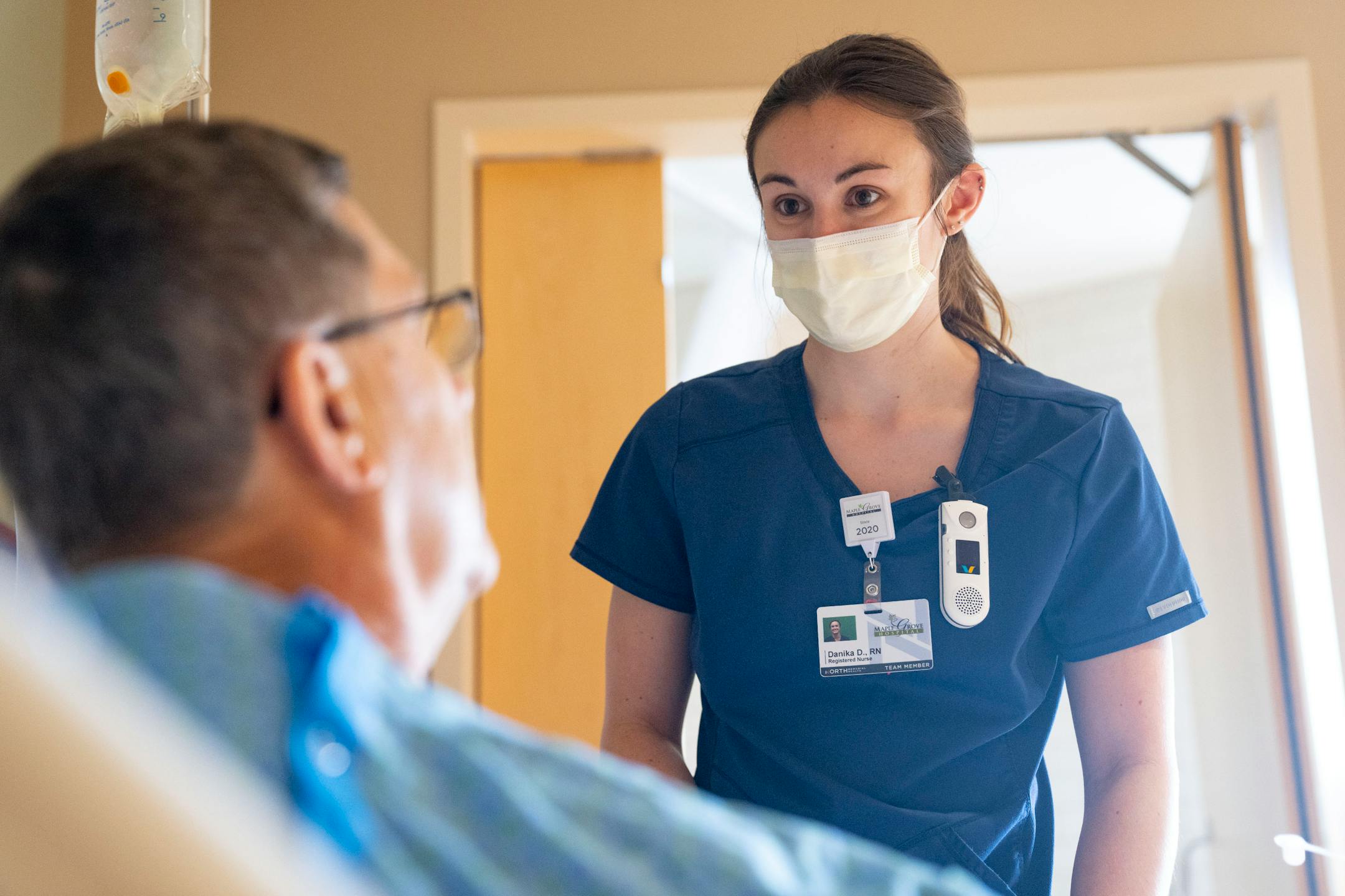 Clay Tutland receives an injection from Danika Dahle, RN, Thursday, March 24, 2022 at Maple Grove Hospital in Maple Grove, Minn. Tutland received a left knee replacement at the hospital and is recovering.