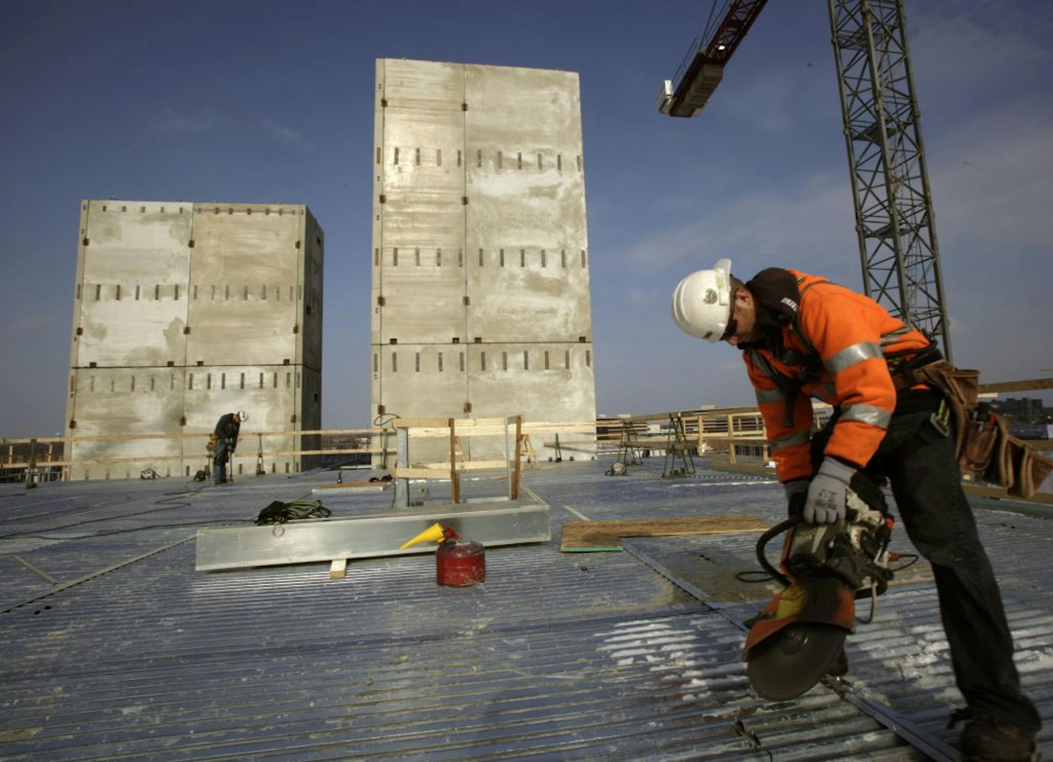 Chase Piepenburg of Frana Cos. cut off metal tabs before concrete was poured on the fifth floor of new apartments at 8055 Penn Av., Bloomington.