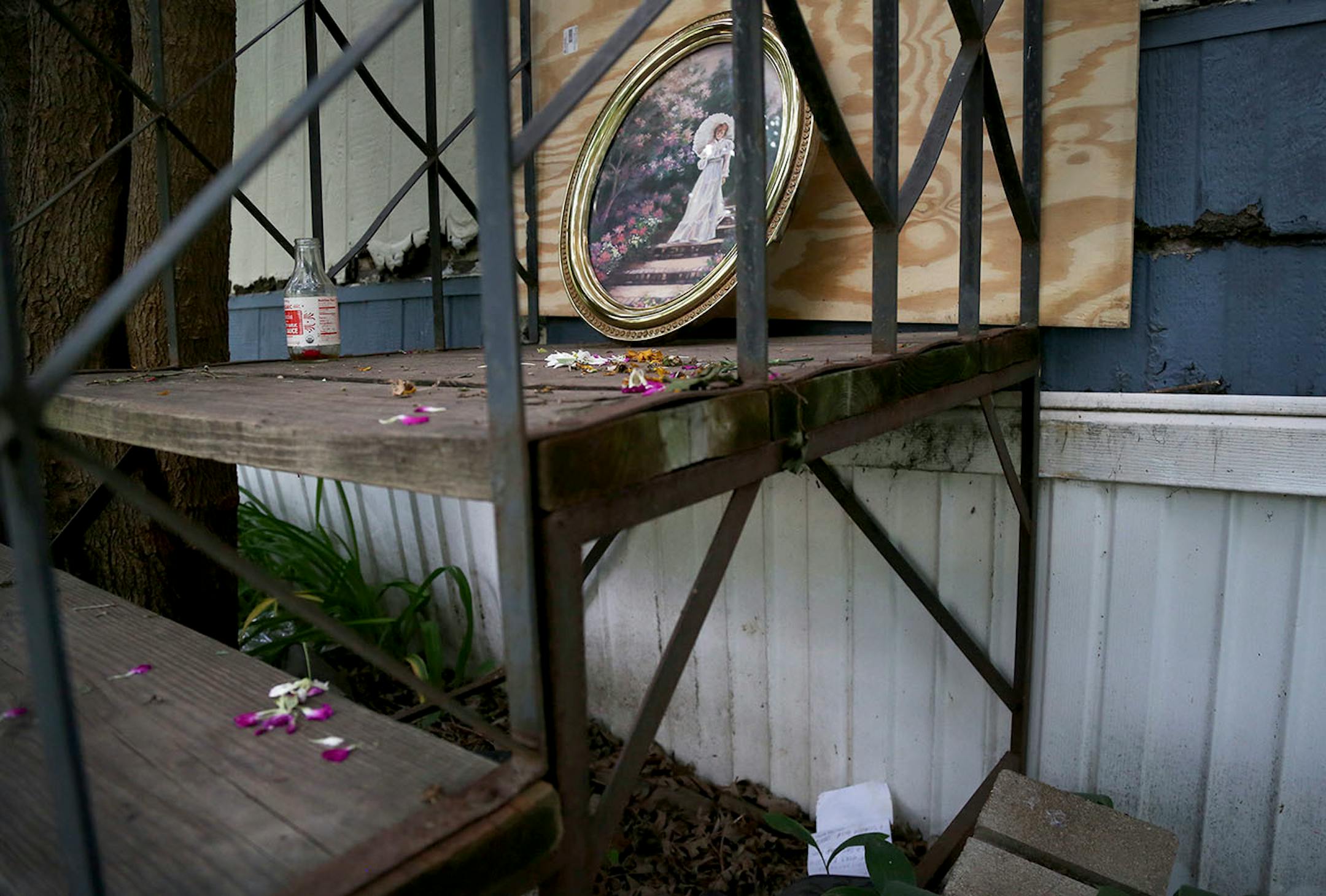 Items left on the steps of Lowry Grove mobile home park resident Frank Adelmann 59, who took his own life days earlier, after a memorial held earlier in the week and seen Thursday, June 29, 2017, in St. Anthony, MN. Residents who knew Adelmann say he told them he wasn't leaving Lowry Grove, both due to the condition of his home (it could not be moved) and a lack of options of where he could go next. Lowry Grove closed it's gate and all residents had to be gone by 12 midnight on July 1,with the s